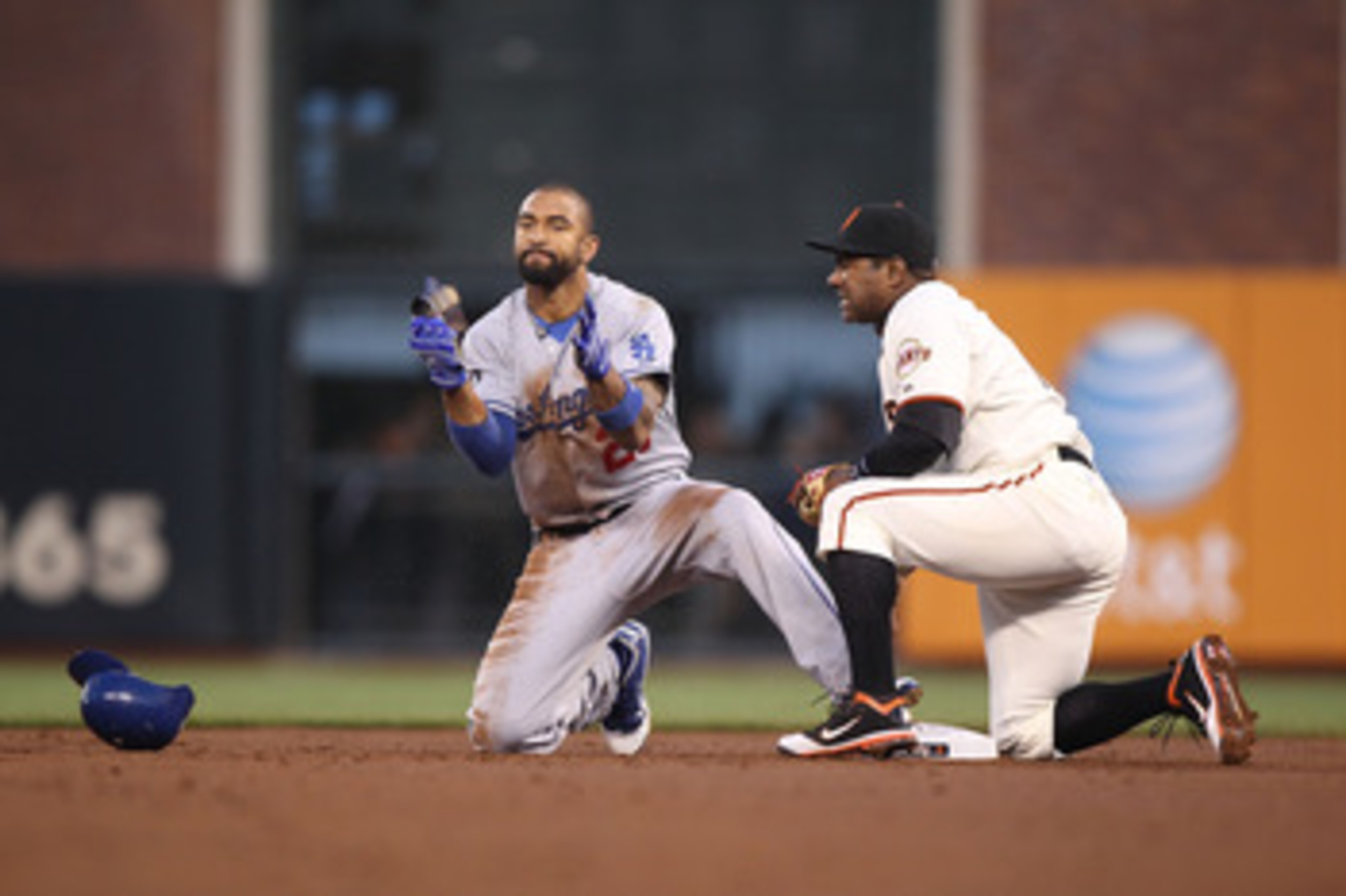 SAN FRANCISCO, CA - APRIL 11: Matt Kemp #27 of the Los Angeles Dodgers celebrates after stealing second base past Miguel Tejada #10 of the San Francisco Giants in the second inning during an MLB game at AT&T Park on April 11, 2011 in San Francisco, Calif SAN FRANCISCO, CA - APRIL 11: Matt Kemp #27 of the Los Angeles Dodgers celebrates after stealing second base past Miguel Tejada #10 of the San Francisco Giants in the second inning during an MLB game at AT&T Park on April 11, 2011 in San Francisco, Calif