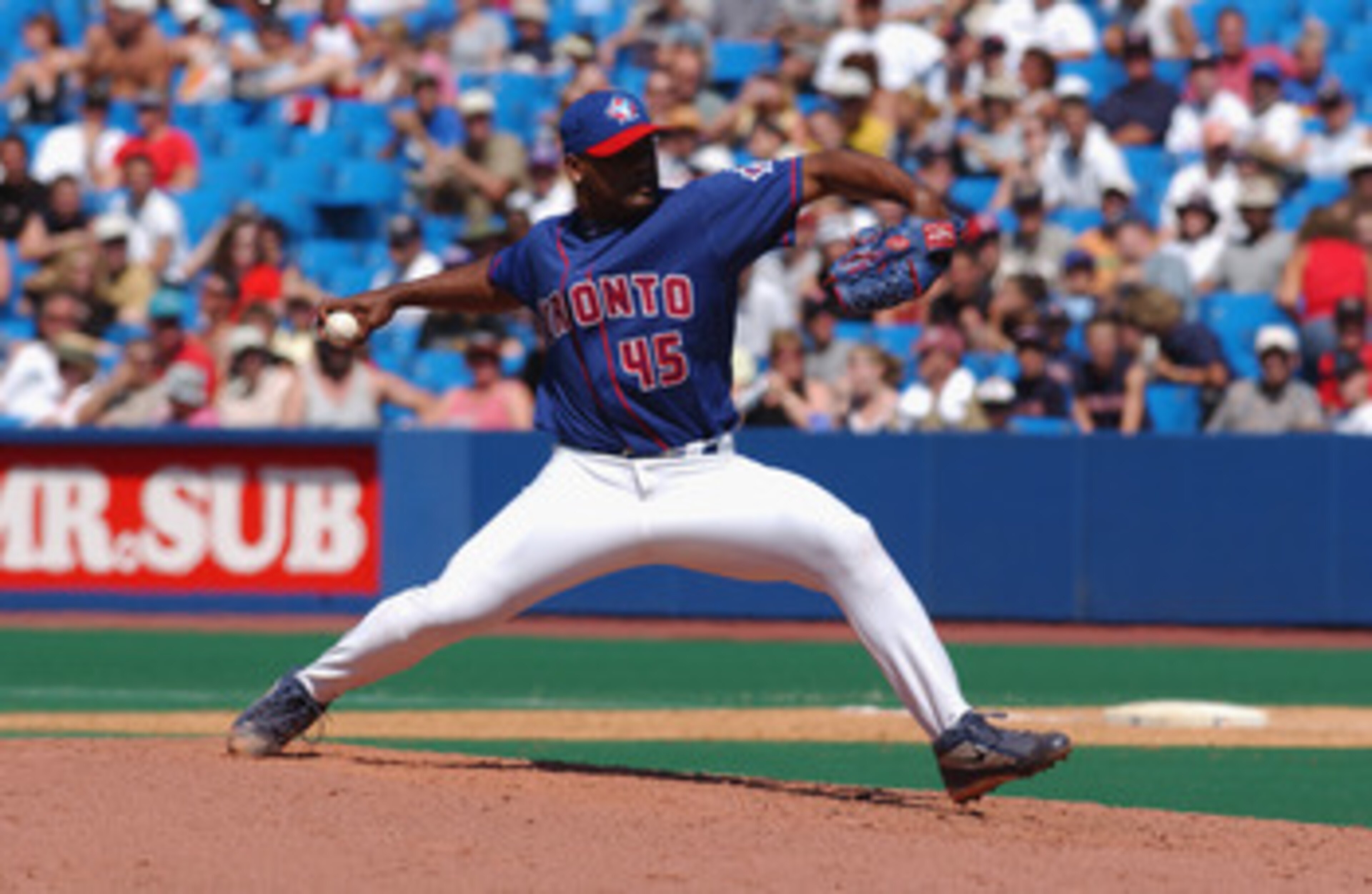 TORONTO - JULY 14 :  Winning pitcher Kelvim Escobar #45 of the Toronto Blue Jays throws the ball against the Boston Red Sox during the game on July 14, 2002 at the Skydome in Toronto, Canada.  The Blue Jays edged the Red Sox 6-5.  (Photo by Dave Sandford/
