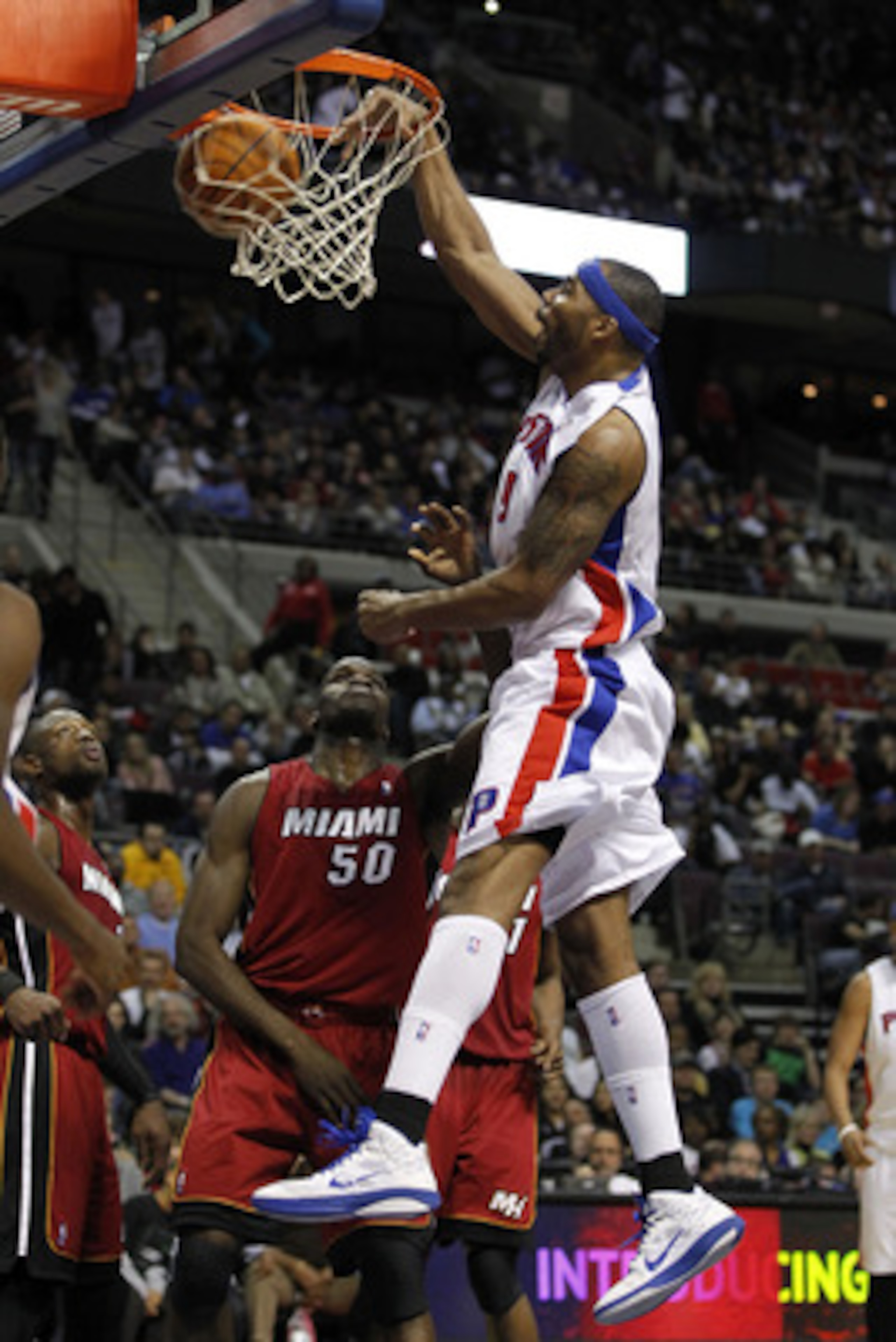 AUBURN HILLS, MI - FEBRUARY 11:  Chris Wilcox #9 of the Detroit Pistons gets in for a dunk over Joel Anthony #50 of the Miami Heat at The Palace of Auburn Hills on February 11, 2011 in Auburn Hills, Michigan. Miami won the game 106-92. NOTE TO USER: User 