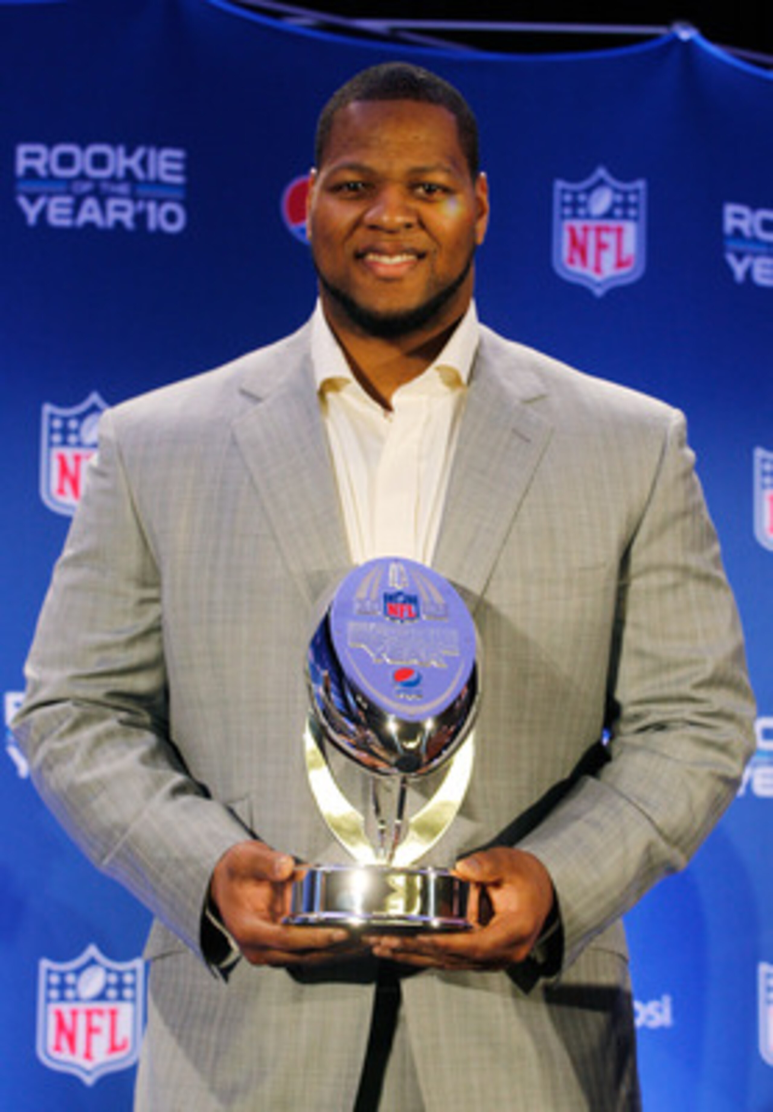 DALLAS, TX - FEBRUARY 03:  Ndamukong Suh #90 of the Detroit Lions poses during a press conference where he accepted Pepsi's 2010 NFL Rookie of the Year Award at the Super Bowl XLV media center on February 3, 2011 in Dallas, Texas. The Green Bay Packers wi