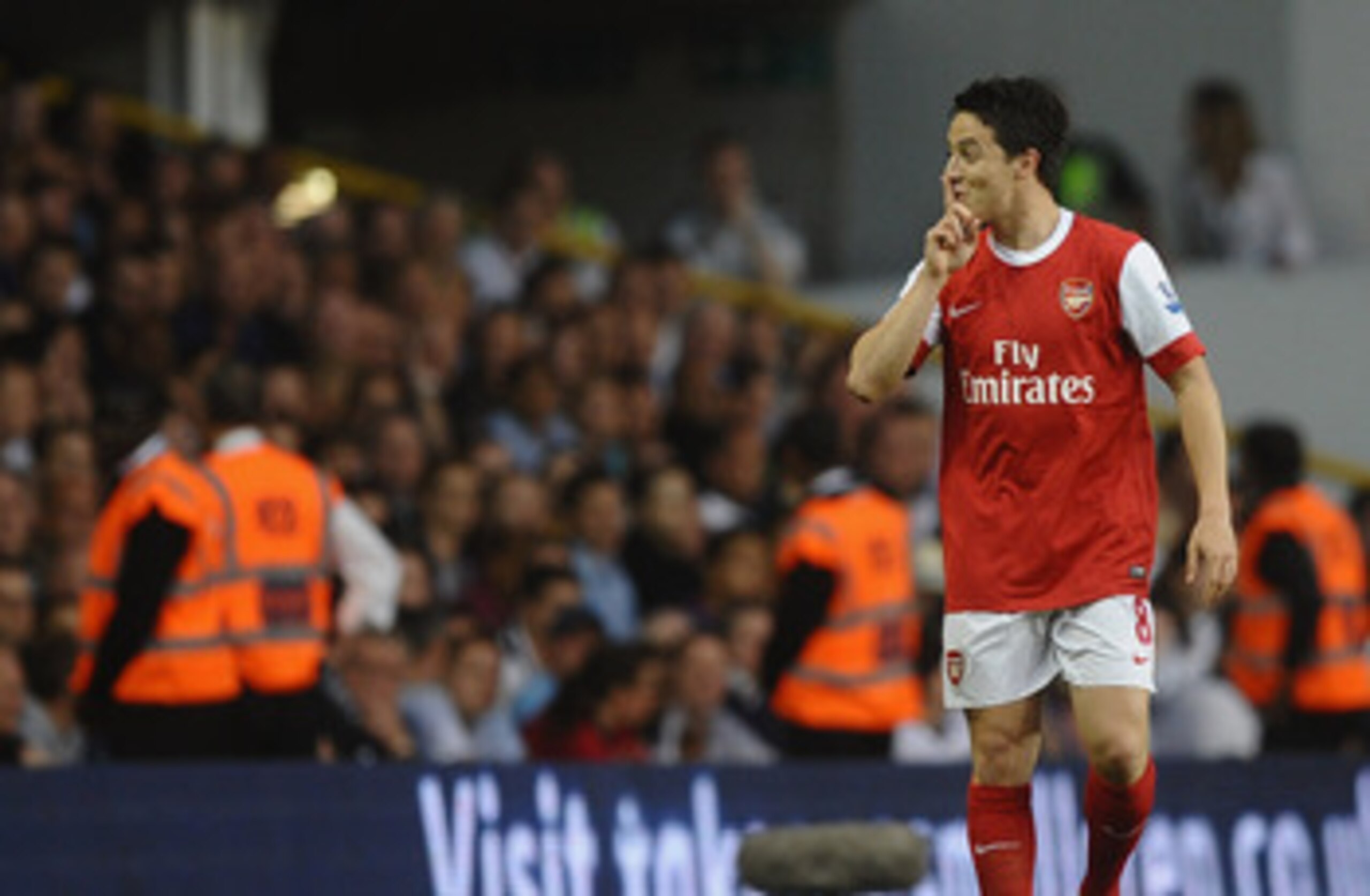 LONDON, ENGLAND - APRIL 20:  Samir Nasri of Arsenal gestures to the Spurs fans after scoring their second goal during the Barclays Premier League match between Tottenham Hotspur and Arsenal at White Hart Lane on April 20, 2011 in London, England.  (Photo