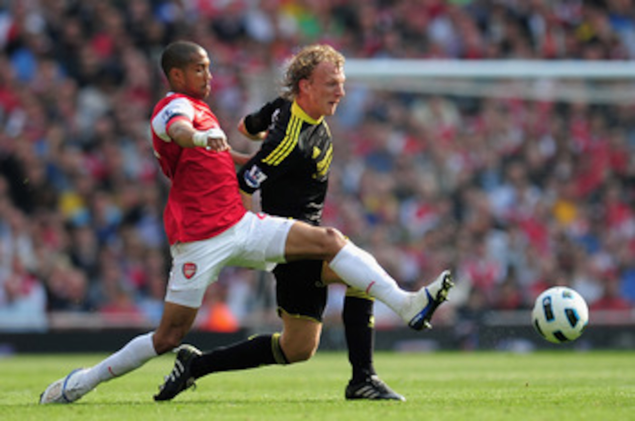 LONDON, ENGLAND - APRIL 17:  Gael Clichy of Arsenal tackles Dirk Kuyt of Liverpool during the Barclays Premier League match between Arsenal and Liverpool at the Emirates Stadium on April 17, 2011 in London, England.  (Photo by Shaun Botterill/Getty Images