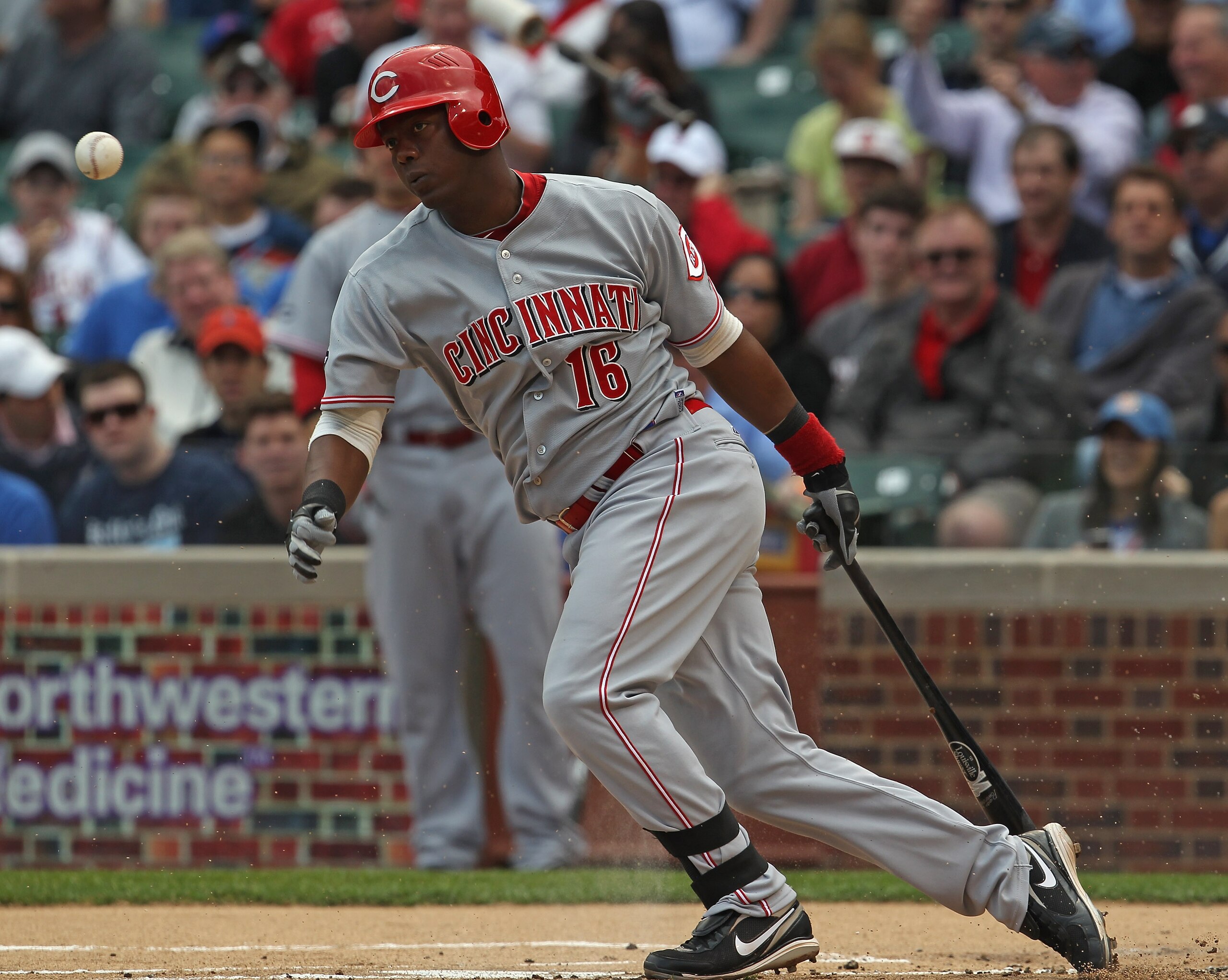 CHICAGO, IL - MAY 06:  Edgar Renteria #16 of the Cincinnati Redsruns after hitting the ball against the Chicago Cubs at Wrigley Field on May 6, 2011 in Chicago, Illinois. The Reds defeated the Cubs 5-4.  (Photo by Jonathan Daniel/Getty Images)