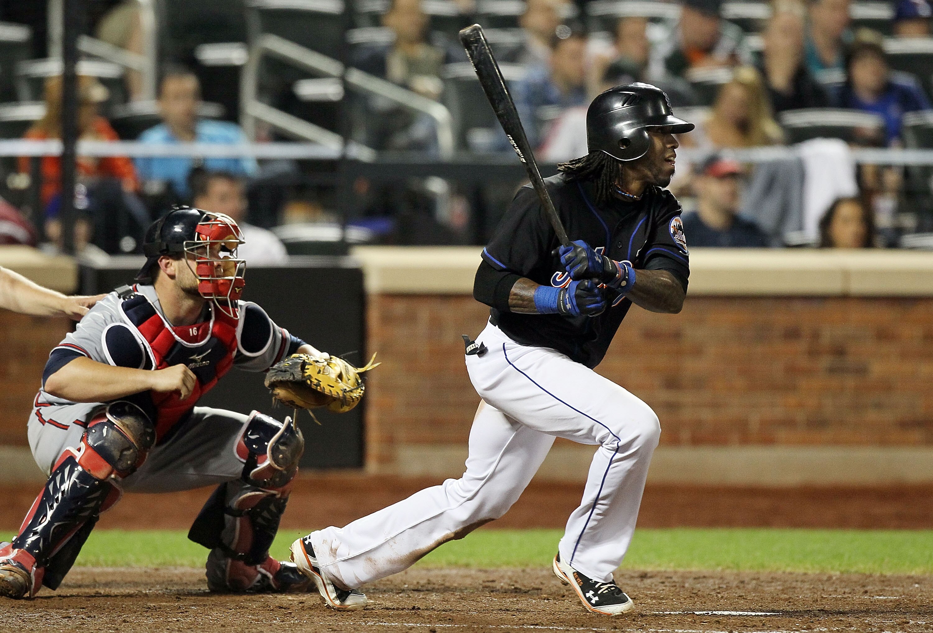 NEW YORK, NY - JUNE 05:  Jose Reyes #7 of the New York Mets follows through on his fourth inning RBI double against the Atlanta Braves on June 5, 2011 at Citi Field in the Flushing neighborhood of the Queens borough of New York City.  (Photo by Jim McIsaa