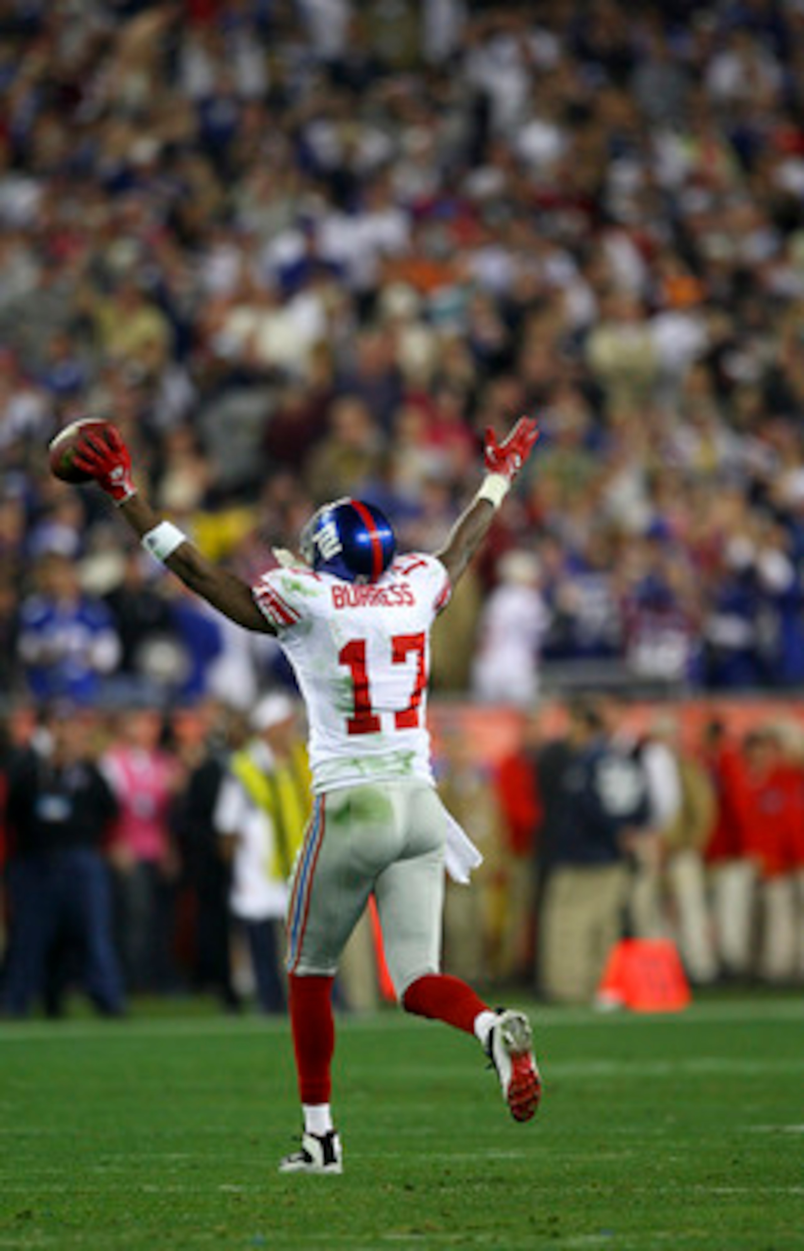 GLENDALE, AZ - FEBRUARY 03:  Wide receiver Plaxico Burress #17 of the New York Giants celebrates after catching a 13-yard touchdown pass in the fourth quarter against the New England Patriots during Super Bowl XLII on February 3, 2008 at the University of