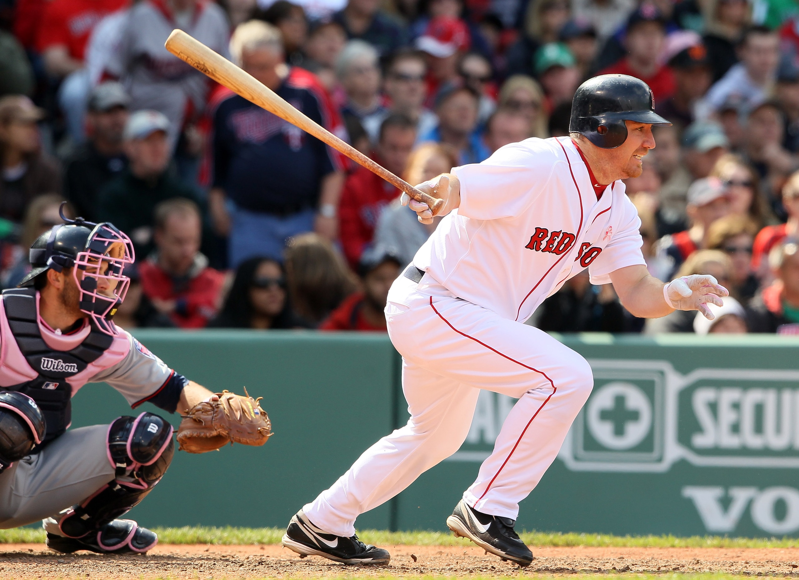 BOSTON, MA - MAY 08:  J.D. Drew #7 of the Boston Red Sox hits an RBI single  in the fifth inning as Drew Butera #41 of the Minnesota Twins catches on May 8, 2011 at Fenway Park in Boston, Massachusetts.  (Photo by Elsa/Getty Images)