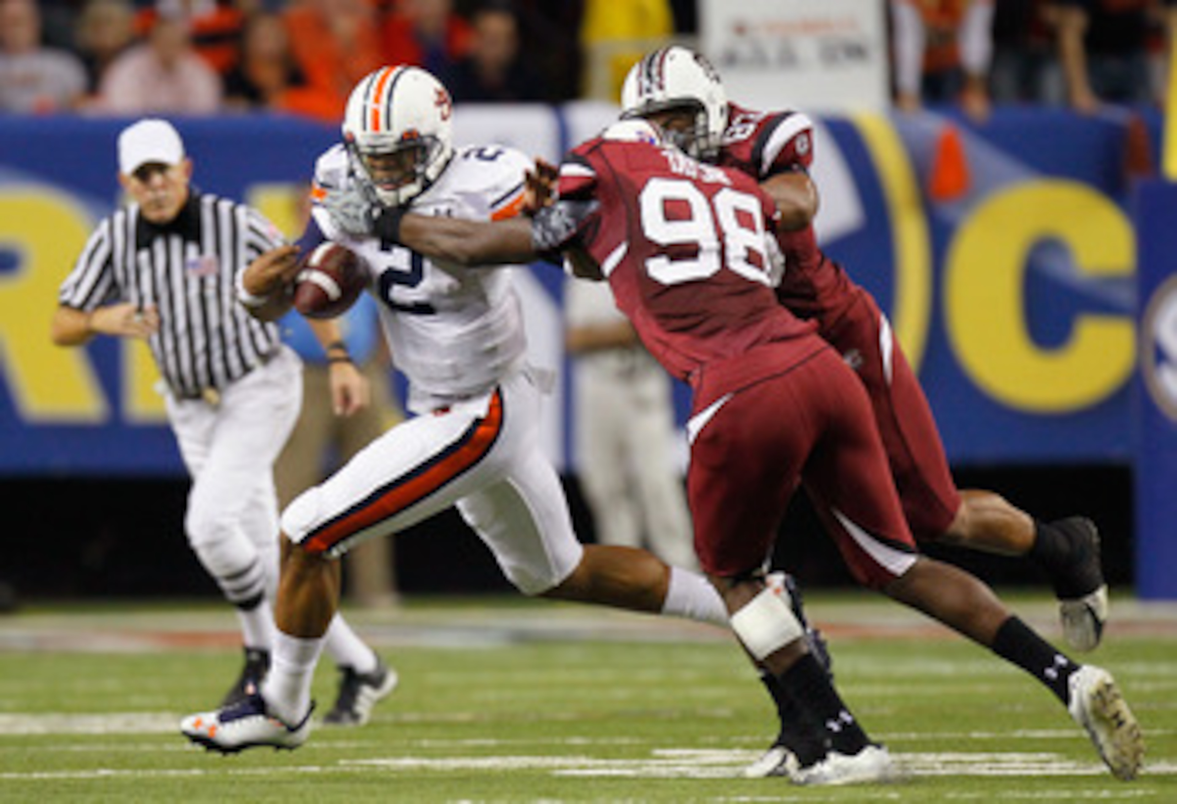 ATLANTA, GA - DECEMBER 04:  Devin Taylor #98 and Cliff Matthews #83 of the South Carolina Gamecocks force a fumble by quarterback Cam Newton #2 of the Auburn Tigers during the 2010 SEC Championship at Georgia Dome on December 4, 2010 in Atlanta, Georgia. 