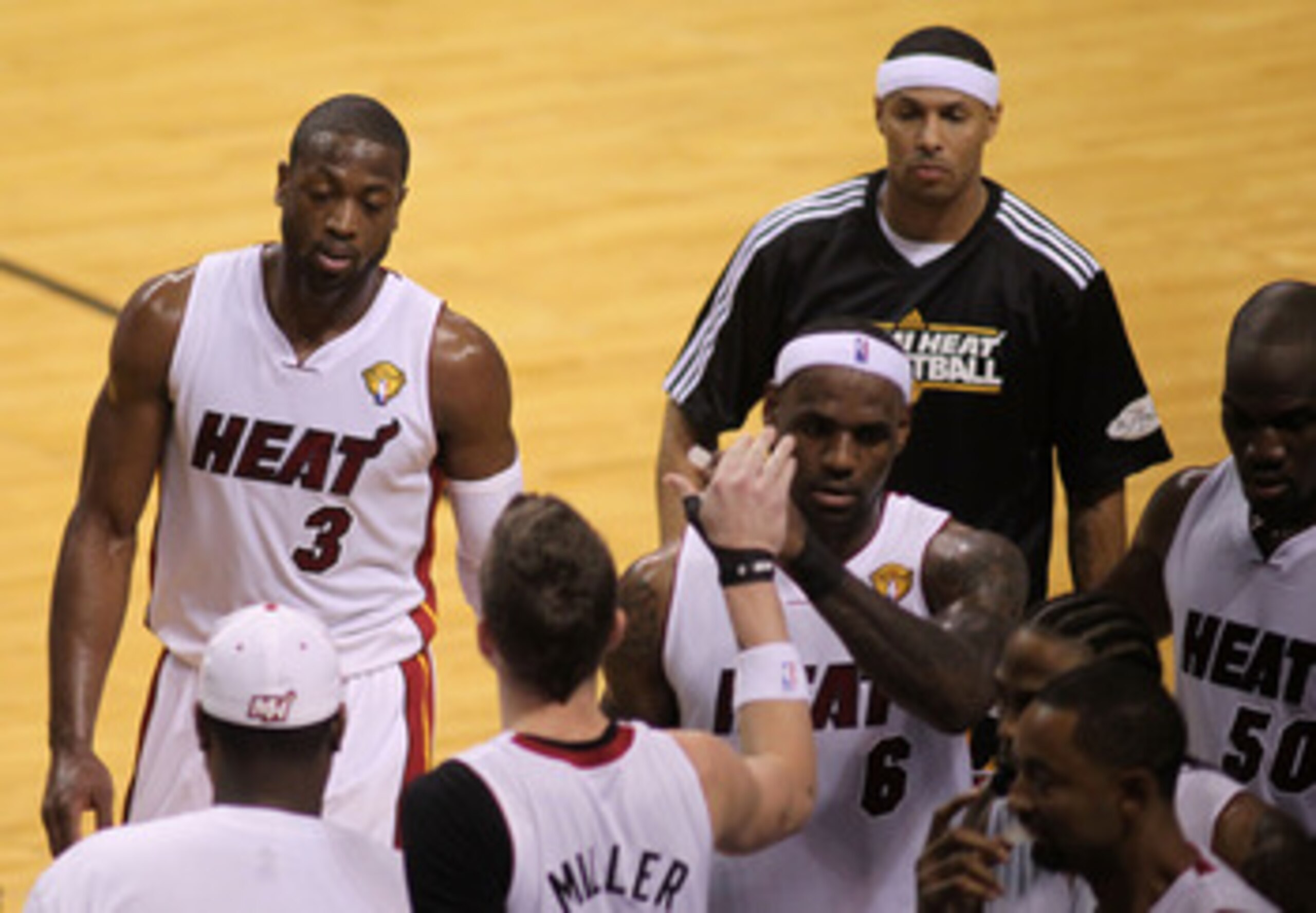 MIAMI, FL - MAY 31:  (L-R) Dwyane Wade #3 and LeBron James #6 of the Miami Heat come to the bench in the first quarter while taking on the Dallas Mavericks in Game One of the 2011 NBA Finals at American Airlines Arena on May 31, 2011 in Miami, Florida. NO