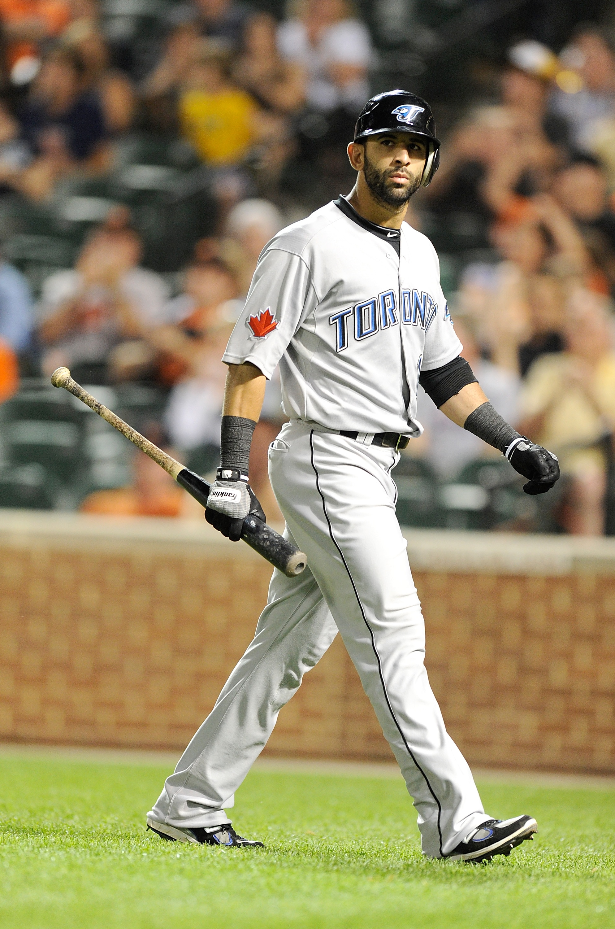 BALTIMORE, MD - JUNE 04:  Jose Bautista #19 of the Toronto Blue Jays walks to the dugout after striking out against the Baltimore Orioles at Oriole Park at Camden Yards on June 4, 2011 in Baltimore, Maryland. The Orioles won the game 5-3. (Photo by Greg F
