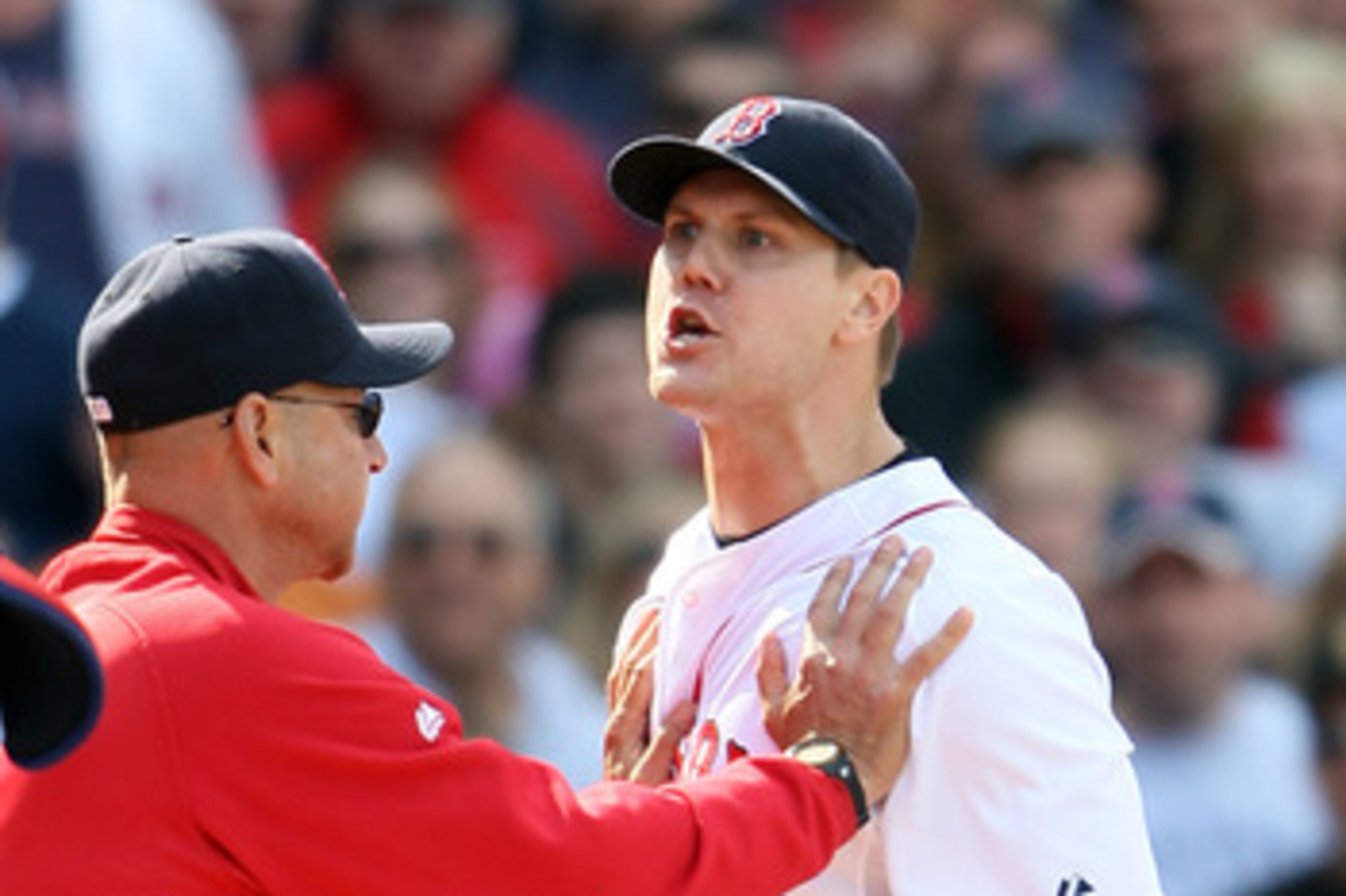 BOSTON, MA - JUNE 04:  Jonathan Papelbon #58 of the Boston Red Sox is held back by manager Terry Francona #47 in the ninth inning against the Oakland Athletics on June 4, 2011 at Fenway Park in Boston, Massachusetts.  (Photo by Elsa/Getty Images)
