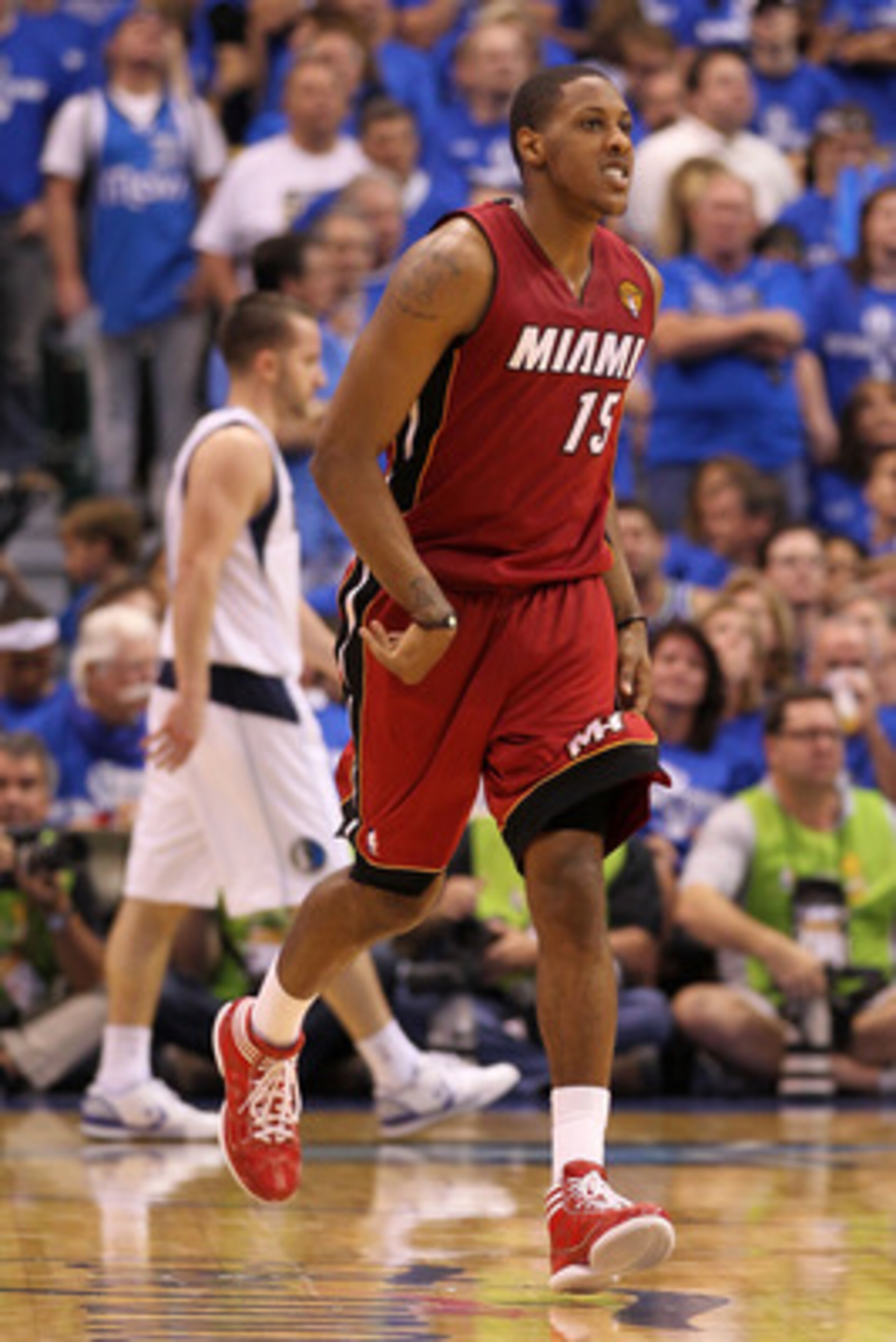 DALLAS, TX - JUNE 05:  Mario Chalmers #15 of the Miami Heat reacts after he made a shot in the second half against the Dallas Mavericks in Game Three of the 2011 NBA Finals at American Airlines Center on June 5, 2011 in Dallas, Texas.  NOTE TO USER: User