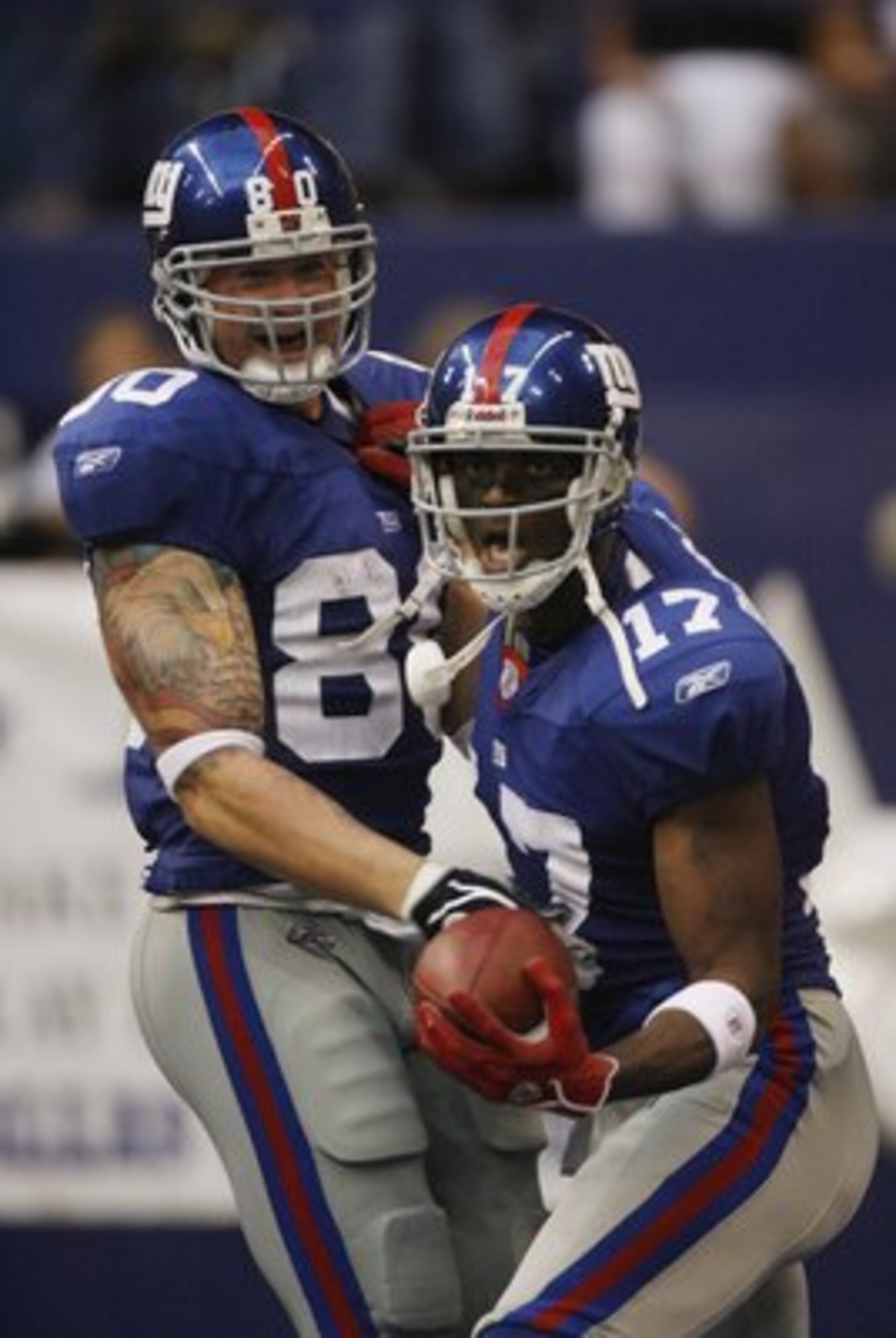 IRVING, TX - SEPTEMBER 9:  Plaxico Burress #17 and Jeremy Shockey #80 of the New York Giants celebrate against the Dallas Cowboys during the NFL game on September 9, 2007 at Texas Stadium in Irving, Texas.  (Photo by Layne Murdoch/Getty Images).