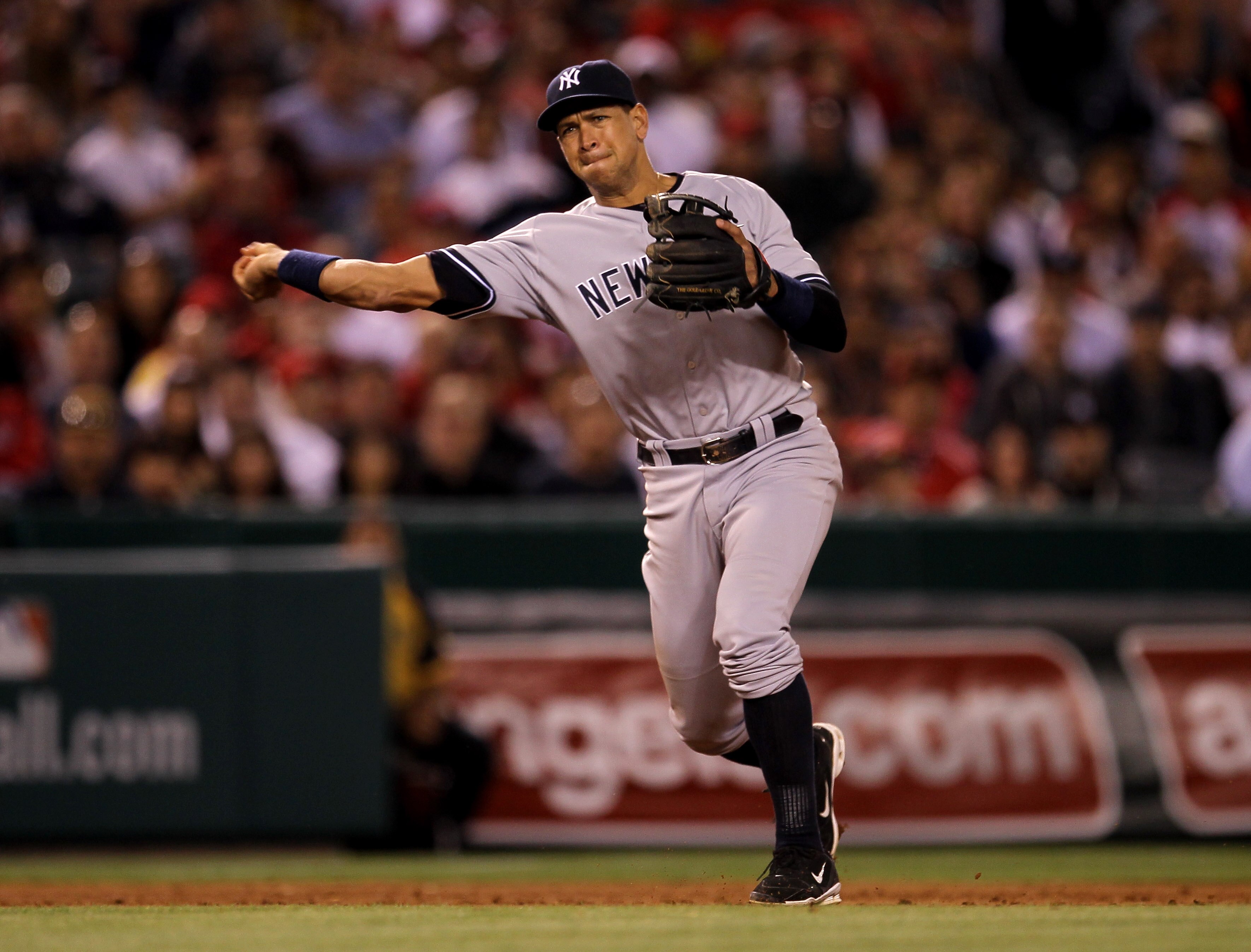 ANAHEIM, CA - JUNE 4: Third baseman Alex Rodriguez #13 of the New York Yankees throws out Mark Trumbo of the Los Angeles Angels of Anaheim in th eninth inning on June 4, 2011 at Angel Stadium in Anaheim, California.  The Yankees won 3-2.  (Photo by Stephe