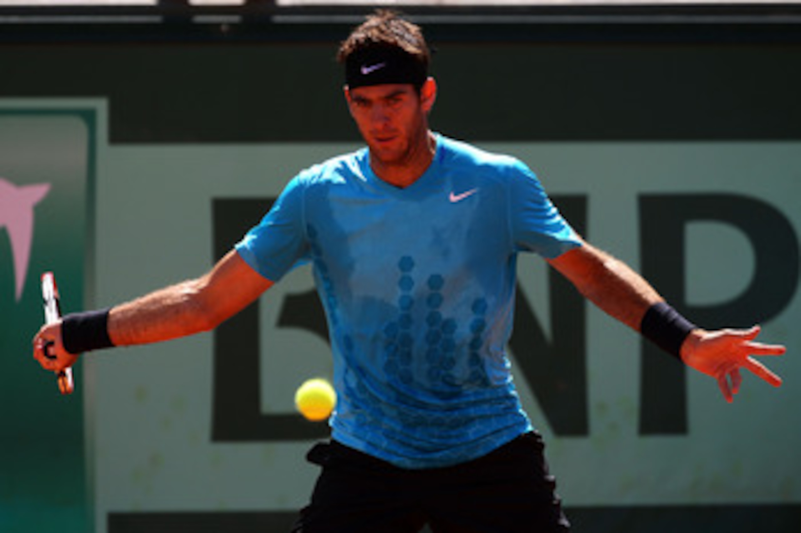 PARIS, FRANCE - MAY 28:  Juan Martin Del Potro of Argentina hits a forehand during the men's singles round three match between Juan Martin Del Potro of Argentina and Novak Djokovic of Serbia on day seven of the French Open at Roland Garros on May 28, 2011