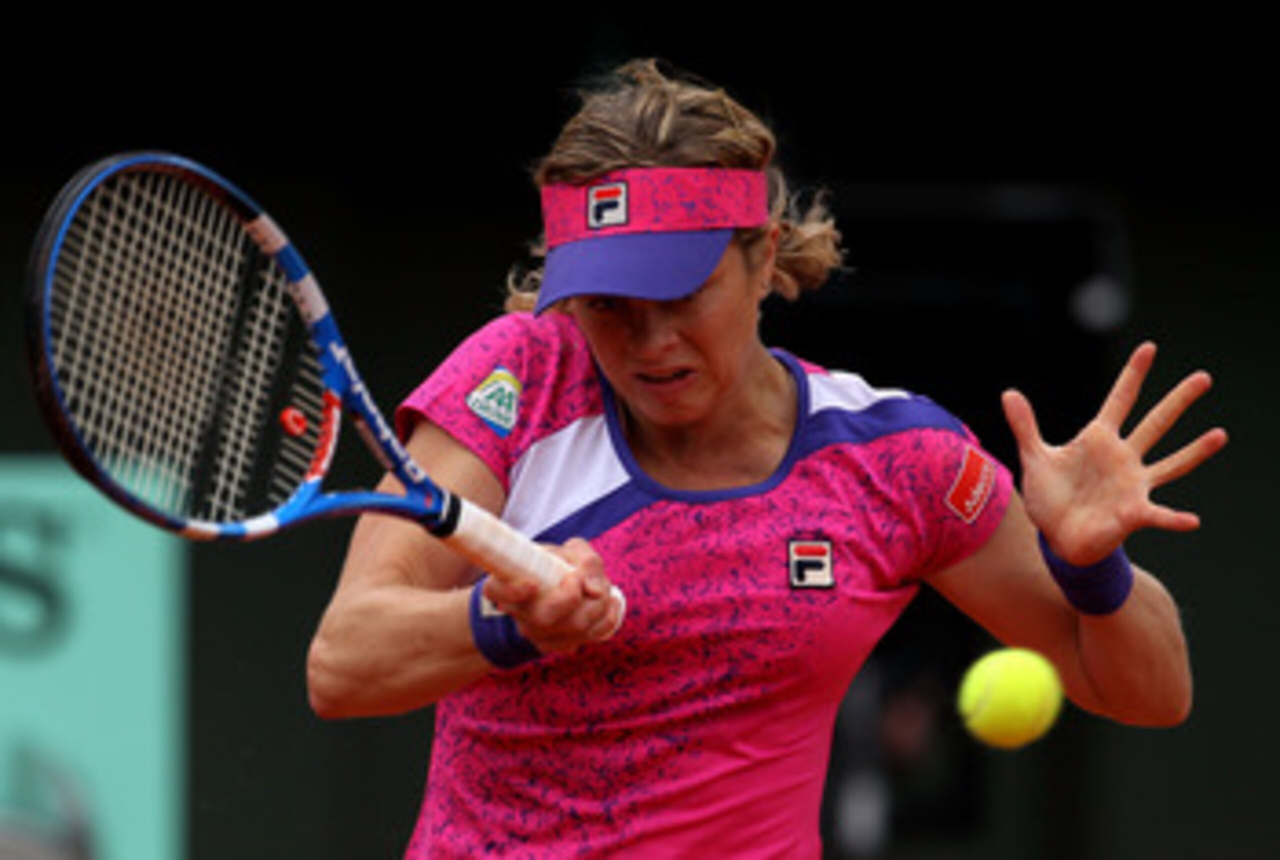 PARIS, FRANCE - MAY 26:  Kim Clijsters of Belgium hits a forehand during the women's singles round two match between Arantxa Rus of Netherlands and Kim Clijsters of Belgium on day five of the French Open at Roland Garros on May 26, 2011 in Paris, France.