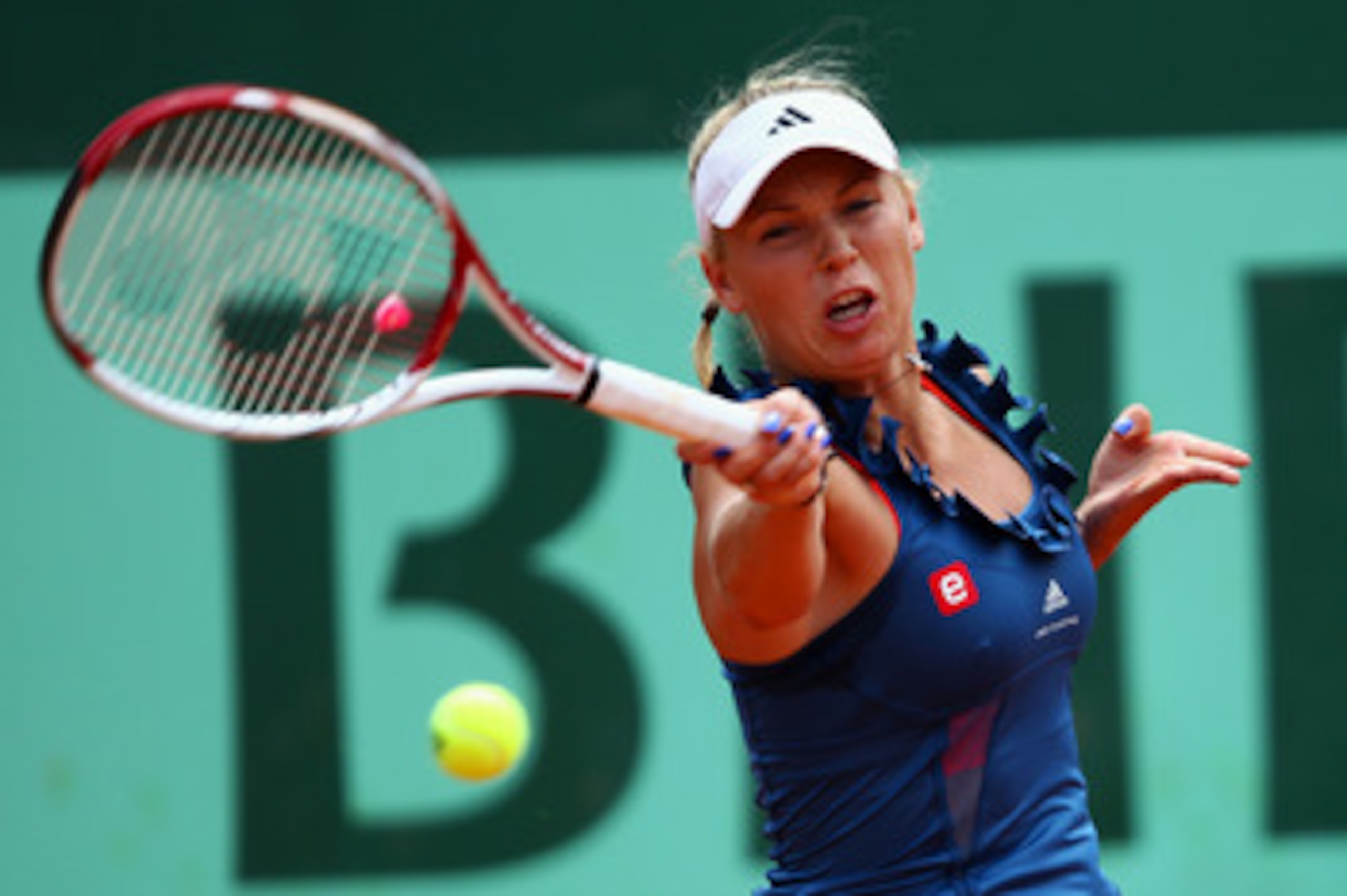 PARIS, FRANCE - MAY 27:  Caroline Wozniacki of Denmark hits a forehand during the women's singles round three match between Caroline Wozniacki of Denmark and Daniela Hantuchova of Slovakia on day six of the French Open at Roland Garros on May 27, 2011 in