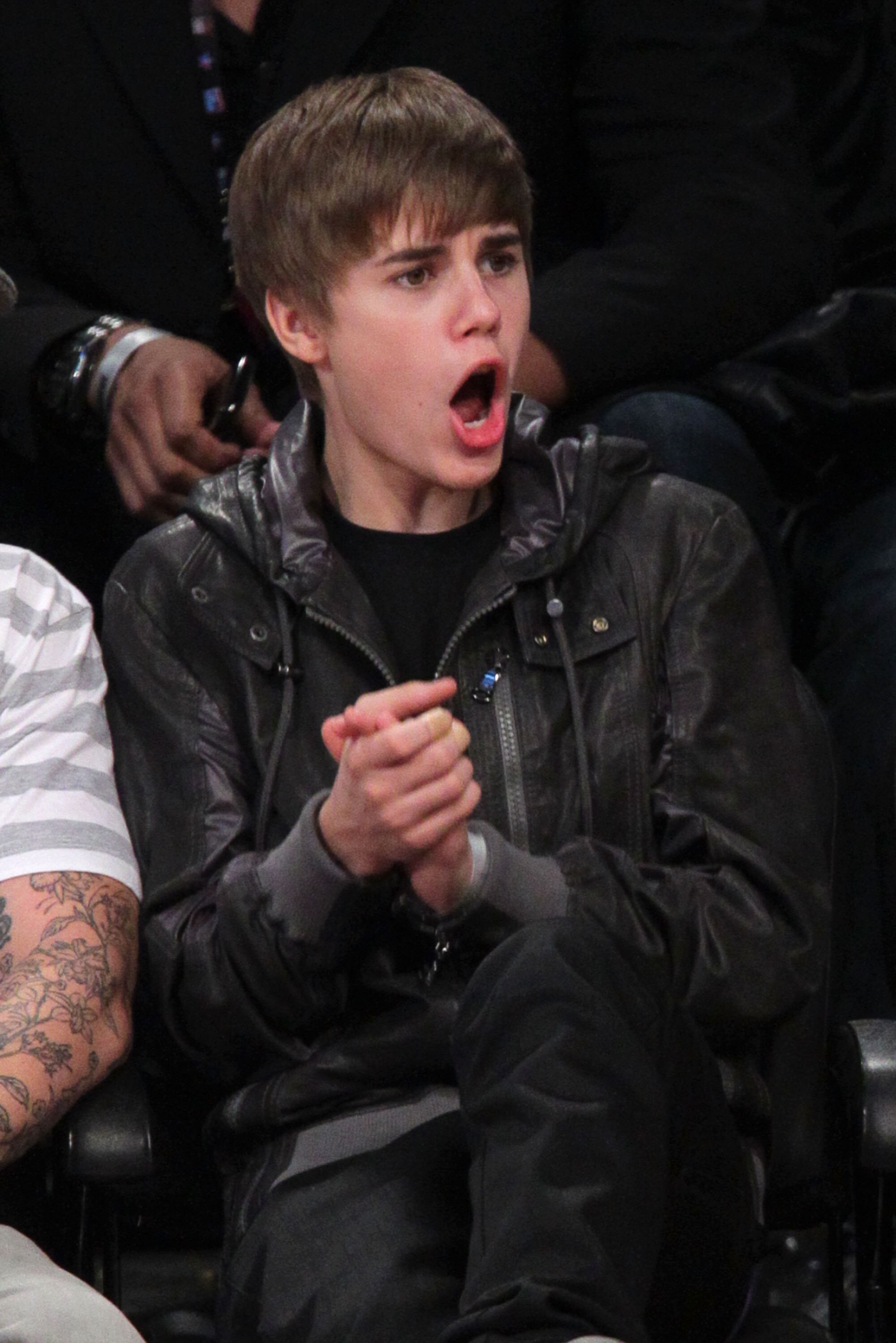 LOS ANGELES, CA - FEBRUARY 20:  Singer Justin Bieber sits in the audience during the 2011 NBA All-Star game at Staples Center on February 20, 2011 in Los Angeles, California. NOTE TO USER: User expressly acknowledges and agrees that, by downloading and or