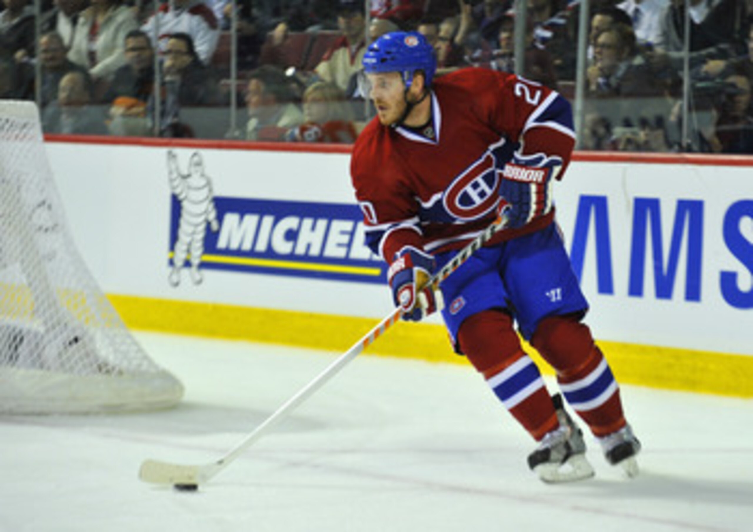 MONTREAL, CANADA - APRIL 18:  James Wisniewski #20 of the Montreal Canadiens turns up ice with the puck in Game Three of the Eastern Conference Quarterfinals against the Boston Bruins during the 2011 NHL Stanley Cup Playoffs at the Bell Centre on April 18