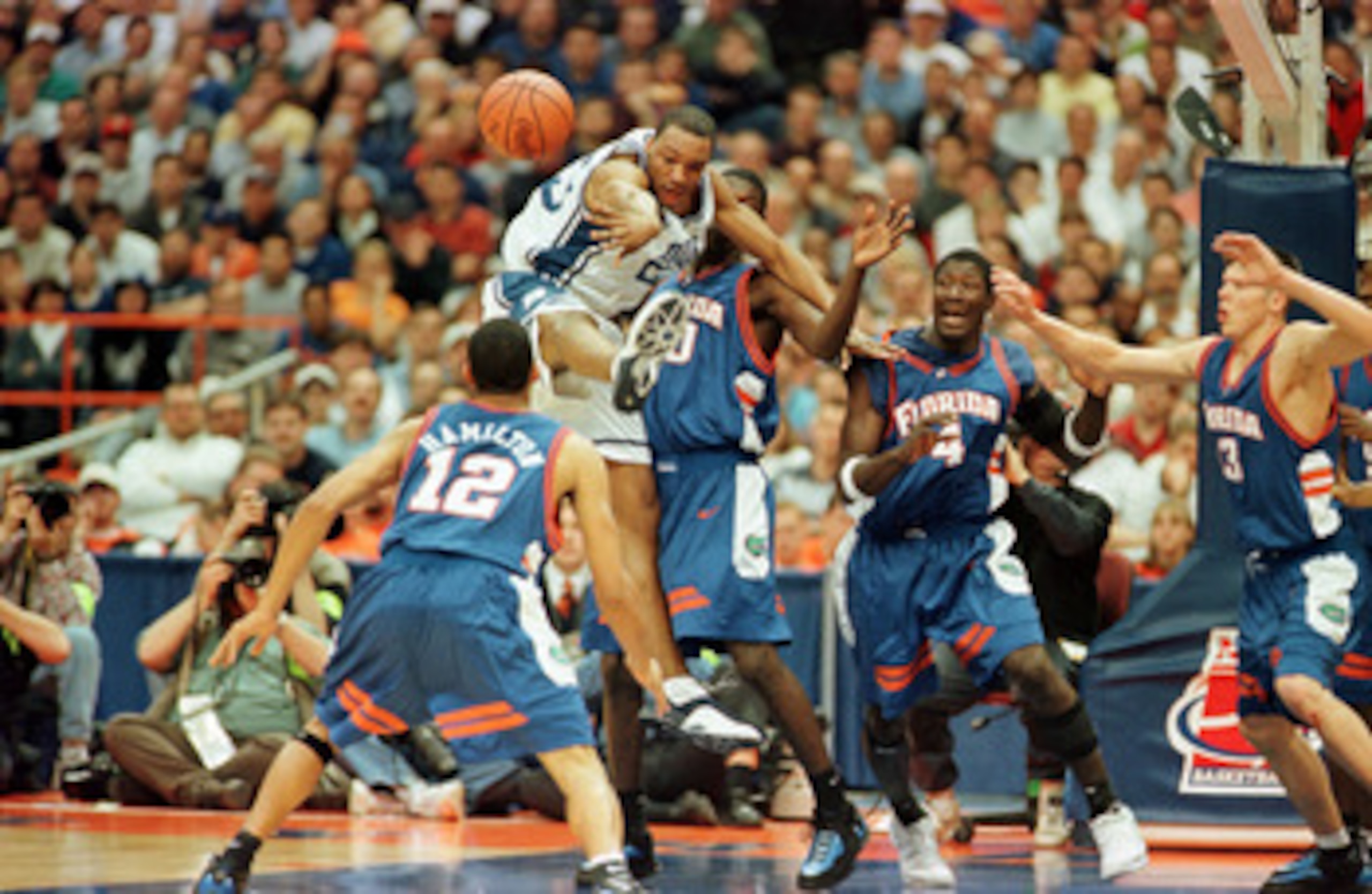 24 Mar 2000:  Duke''s Chris Carrawell #23 makes a block as Florida''s Justin Hamilton #12, Udonis Haslem #50 Donnell Harvey #4 and Mike Miller #13 look on during the NCAA East Regional Semifinal game between the University of Florida Gators and the Duke U