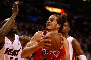 MIAMI, FL - MAY 24:  Joakim Noah #13 of the Chicago Bulls moves the ball inside against Joel Anthony #50 of the Miami Heat in Game Four of the Eastern Conference Finals during the 2011 NBA Playoffs on May 24, 2011 at American Airlines Arena in Miami, Flor