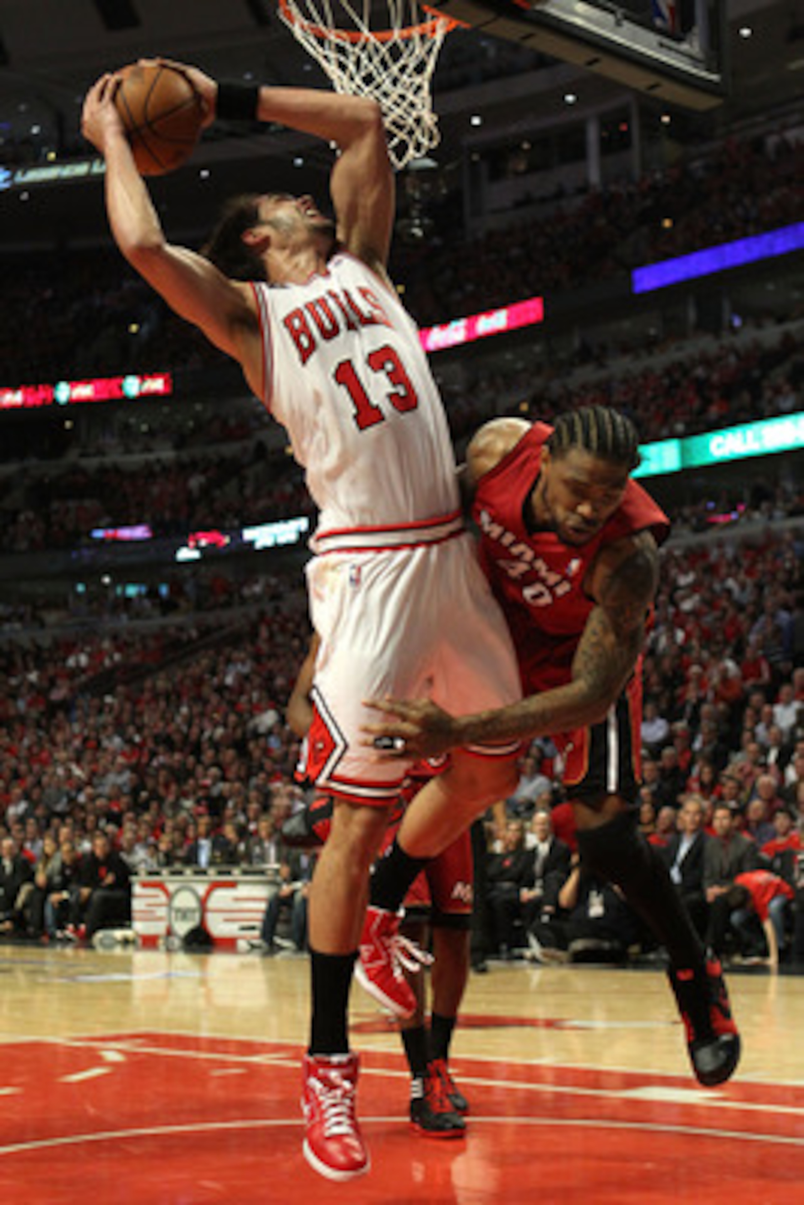 CHICAGO, IL - MAY 26:  Joakim Noah #13 of the Chicago Bulls attempts a shot against Udonis Haslem #40 of the Miami Heat in Game Five of the Eastern Conference Finals during the 2011 NBA Playoffs on May 26, 2011 at the United Center in Chicago, Illinois. N