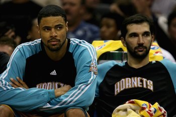 SAN ANTONIO - MAY 15:  Tyson Chandler #6 and Peja Stojakovic #16 of the New Orleans Hornets sit on the bench during the Hornets' loss to the San Antonio Spurs in Game Six of the Western Conference Semifinals during the 2008 NBA Playoffs on May 15, 2008 at