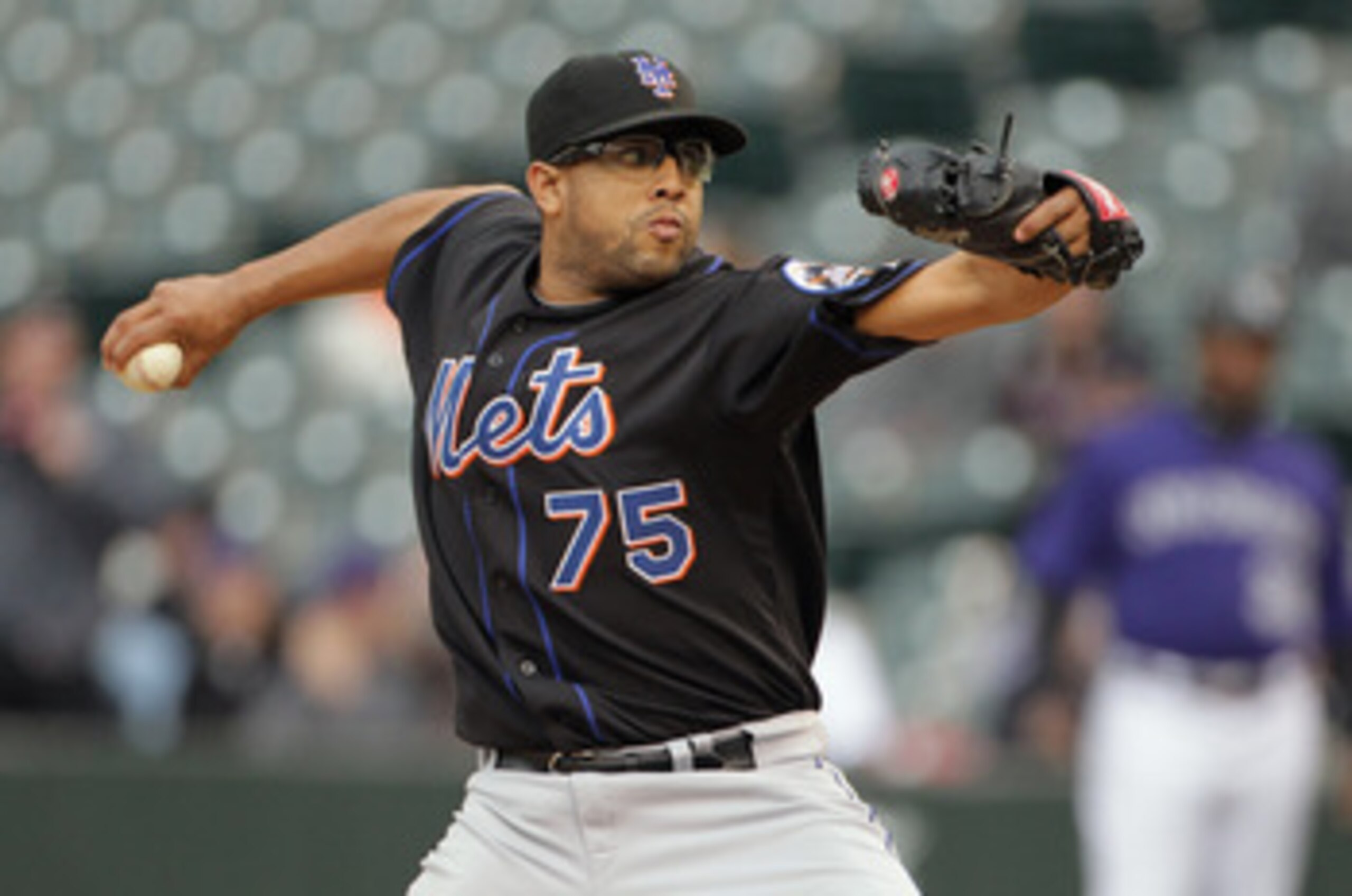 DENVER, CO - MAY 12:  Pitcher Francisco Rodriguez #75 of the New York Mets delivers against the Colorado Rockies at Coors Field on May 12, 2011 in Denver, Colorado.  (Photo by Doug Pensinger/Getty Images)