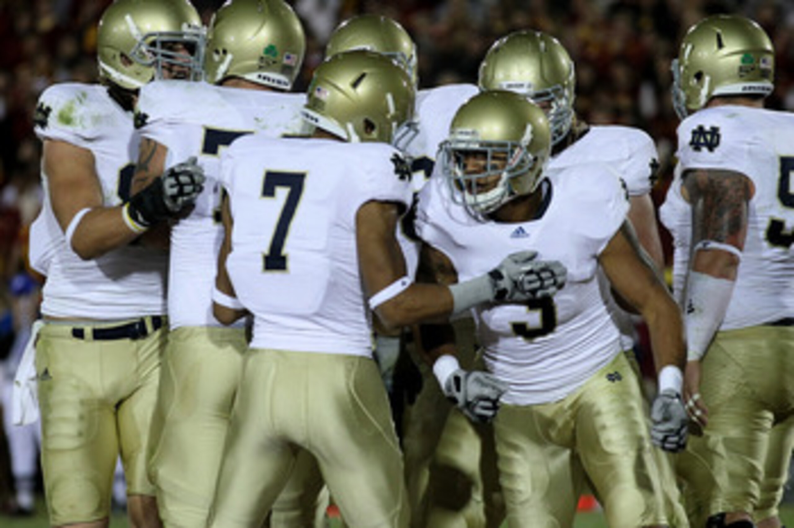 LOS ANGELES - NOVEMBER 27:  Wide receiver Michael Floyd #3 of the Notre Dame Fighting Irish celebrates with wide receiver T.J. Jones #7 after making a one yard touchdown catch against the USC Trojans at the Los Angeles Memorial Coliseum on November 27, 20