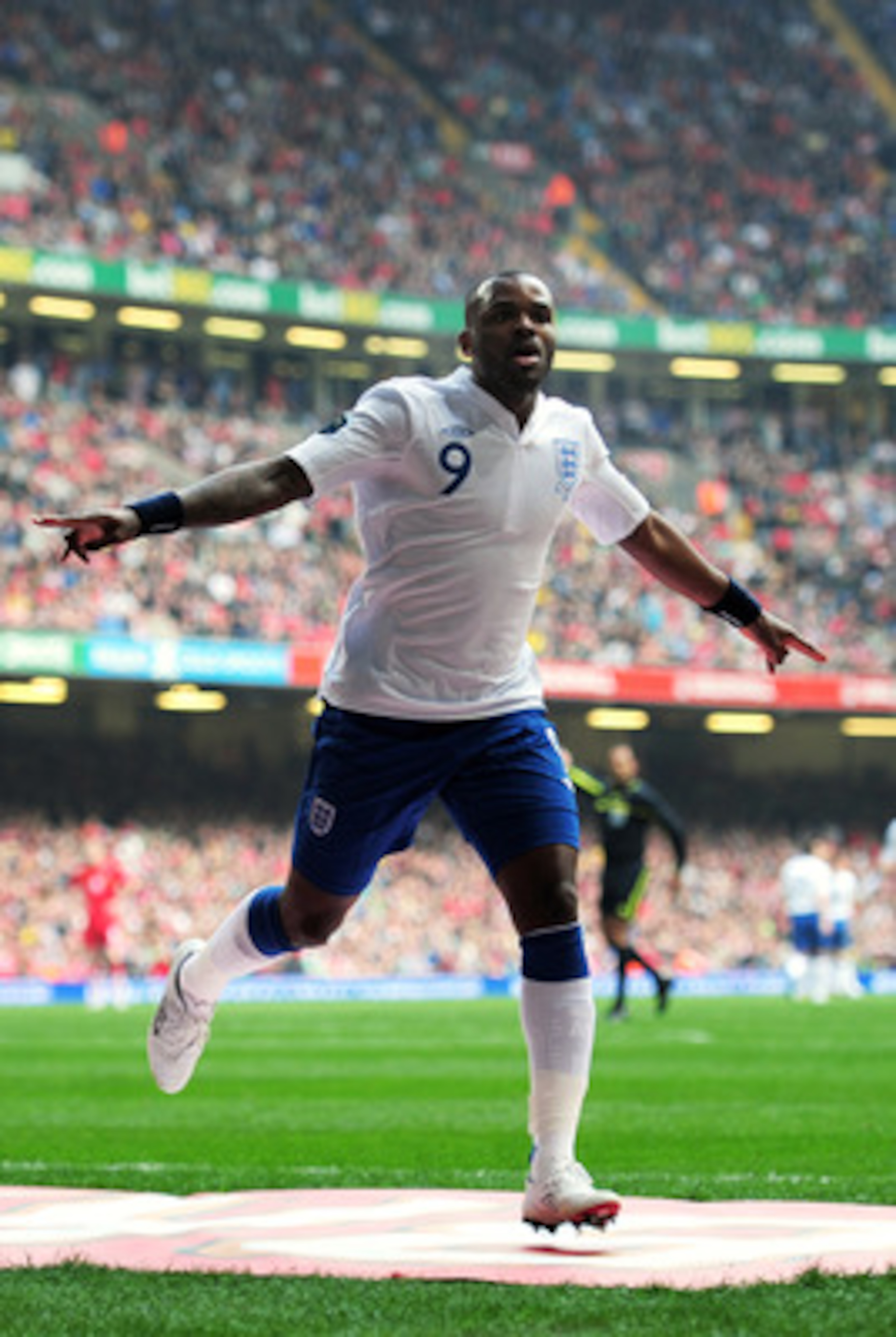 CARDIFF, WALES - MARCH 26:  Darren Bent of England celebrates after scoring his team's second goal during the UEFA EURO 2012 Group G qualifying match between Wales and England at the Millennium Stadium on March 26, 2011 in Cardiff, Wales.  (Photo by Shaun