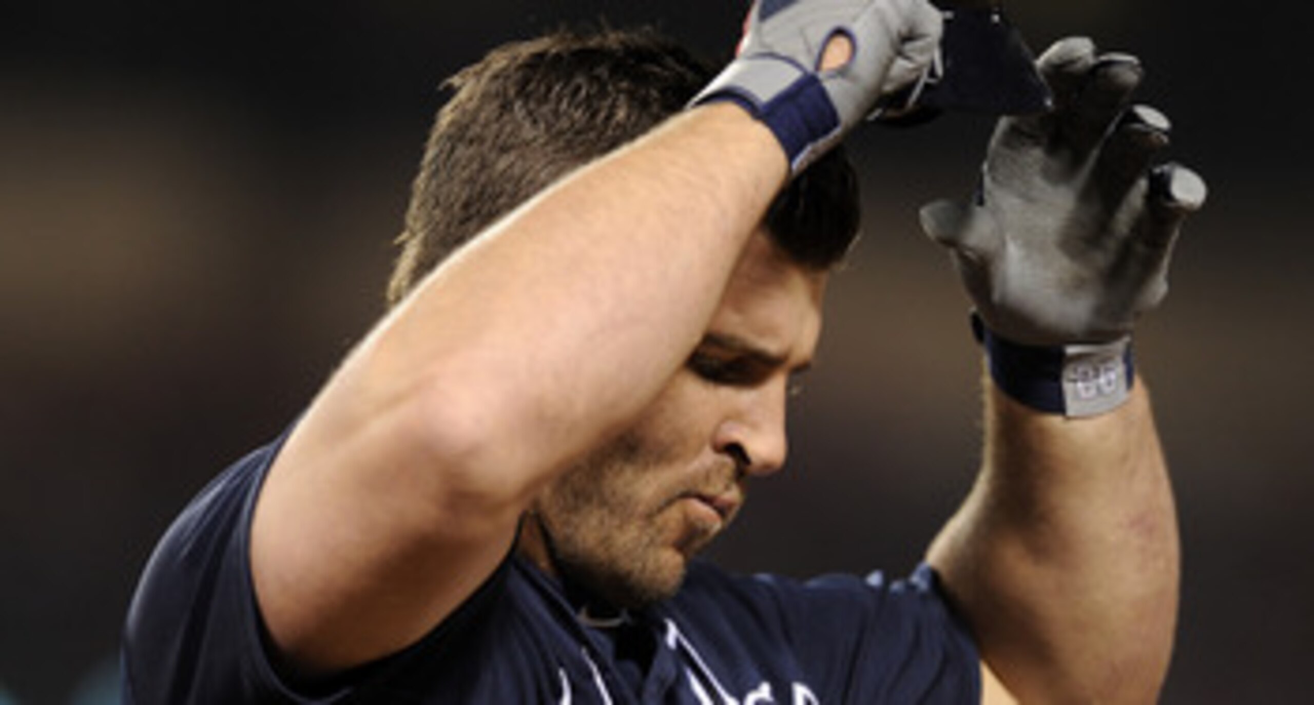 ANAHEIM, CA - MAY 21:  Dan Uggla #26 of the Atlanta Braves reacts as he grounds out with men in scoring position against the Los Angeles Angels during the sixth inning at Angel Stadium on May 21, 2011 in Anaheim, California.  (Photo by Harry How/Getty Ima