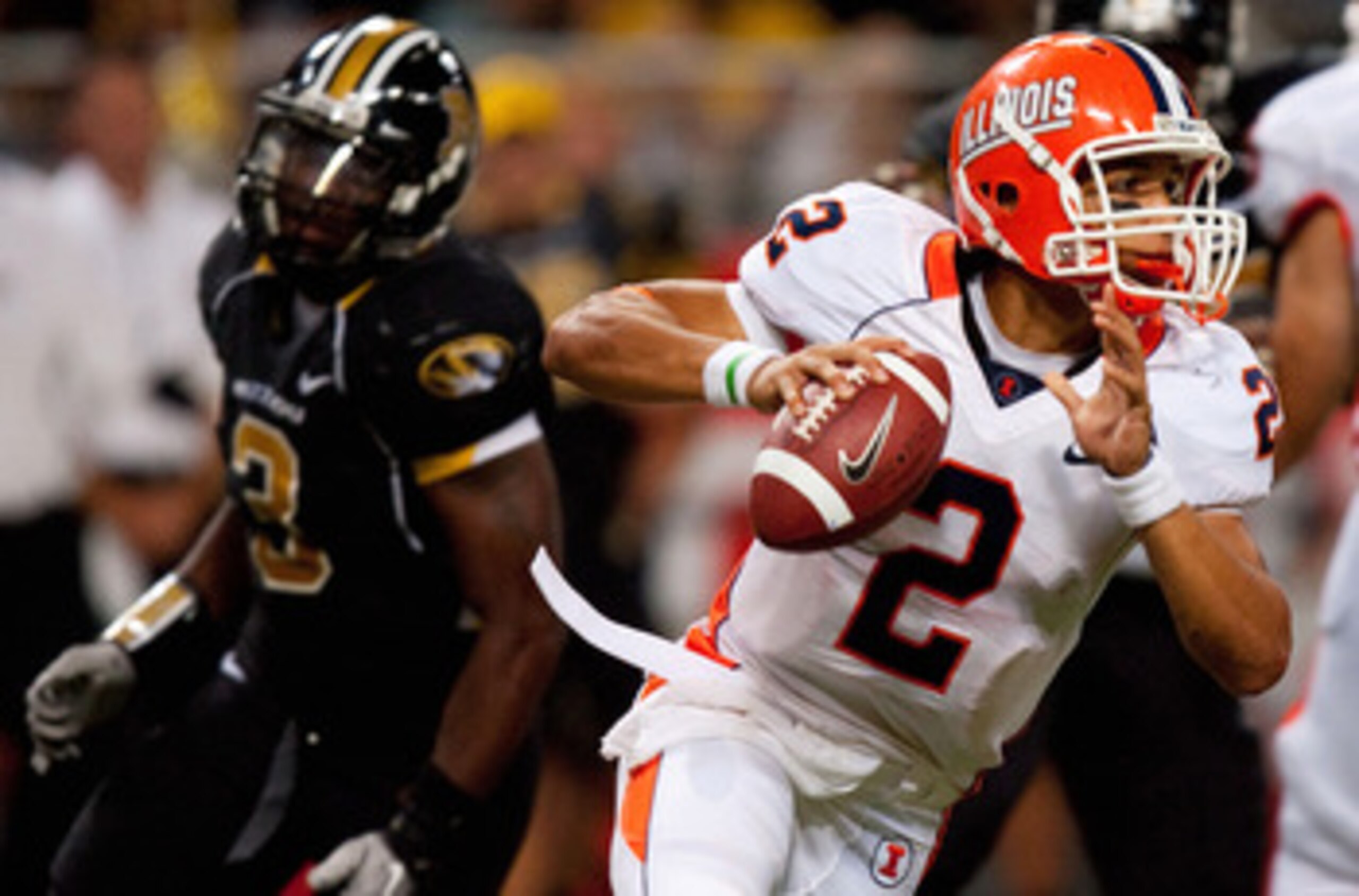 ST. LOUIS - SEPTEMBER 4: Nathan Scheelhaase #2 of the University of Illinois Fighting Illini scrambles against the University of Missouri Tigers during the State Farm Arch Rivalry game on September 4, 2010 at the Edward Jones Dome in St. Louis, Missouri.