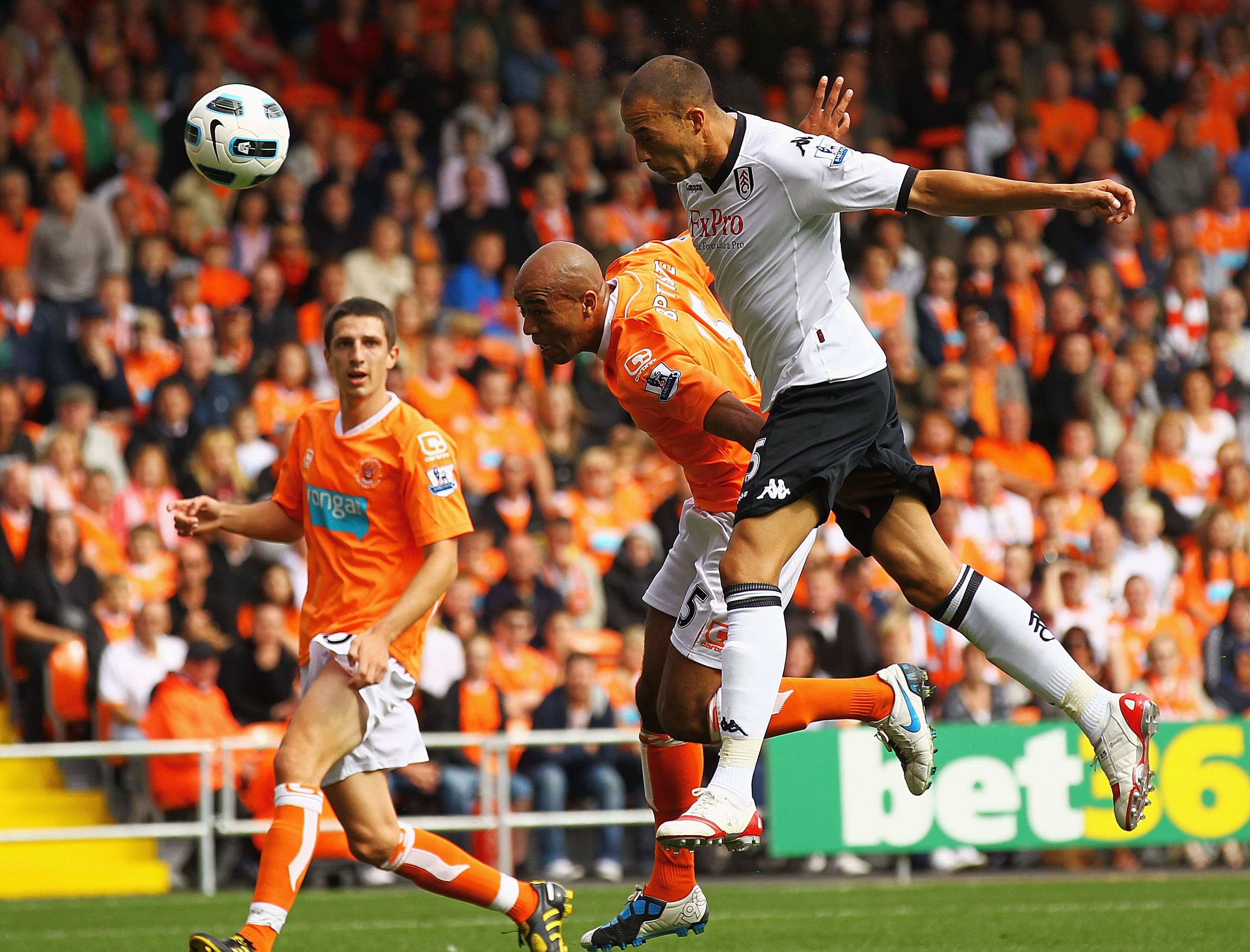 BLACKPOOL, ENGLAND - AUGUST 28:  Bobby Zamora of Fulham beats Alex Baptiste of Blackpool to score a goal during the Barclays Premier League match between Blackpool and Fulham at Bloomfield Road on August 28, 2010 in Blackpool, England.  (Photo by Matthew