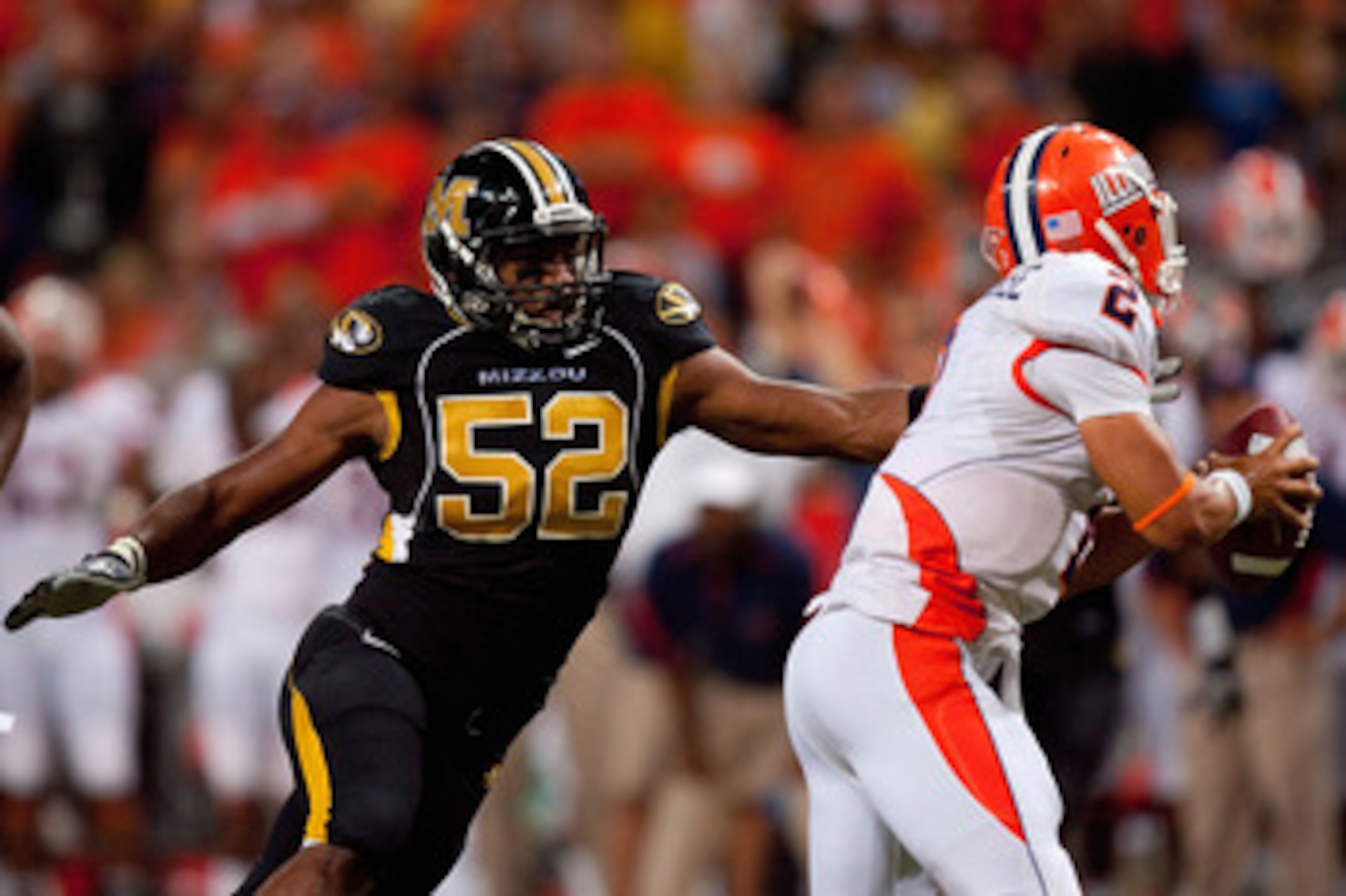 ST. LOUIS - SEPTEMBER 4: Michael Sam #52 of the University of Missouri Tigers looks to sack Nathan Scheelhaase #2 of the University of Illinois Fighting Illini during the State Farm Arch Rivalry game on September 4, 2010 at the Edward Jones Dome in St. Lo
