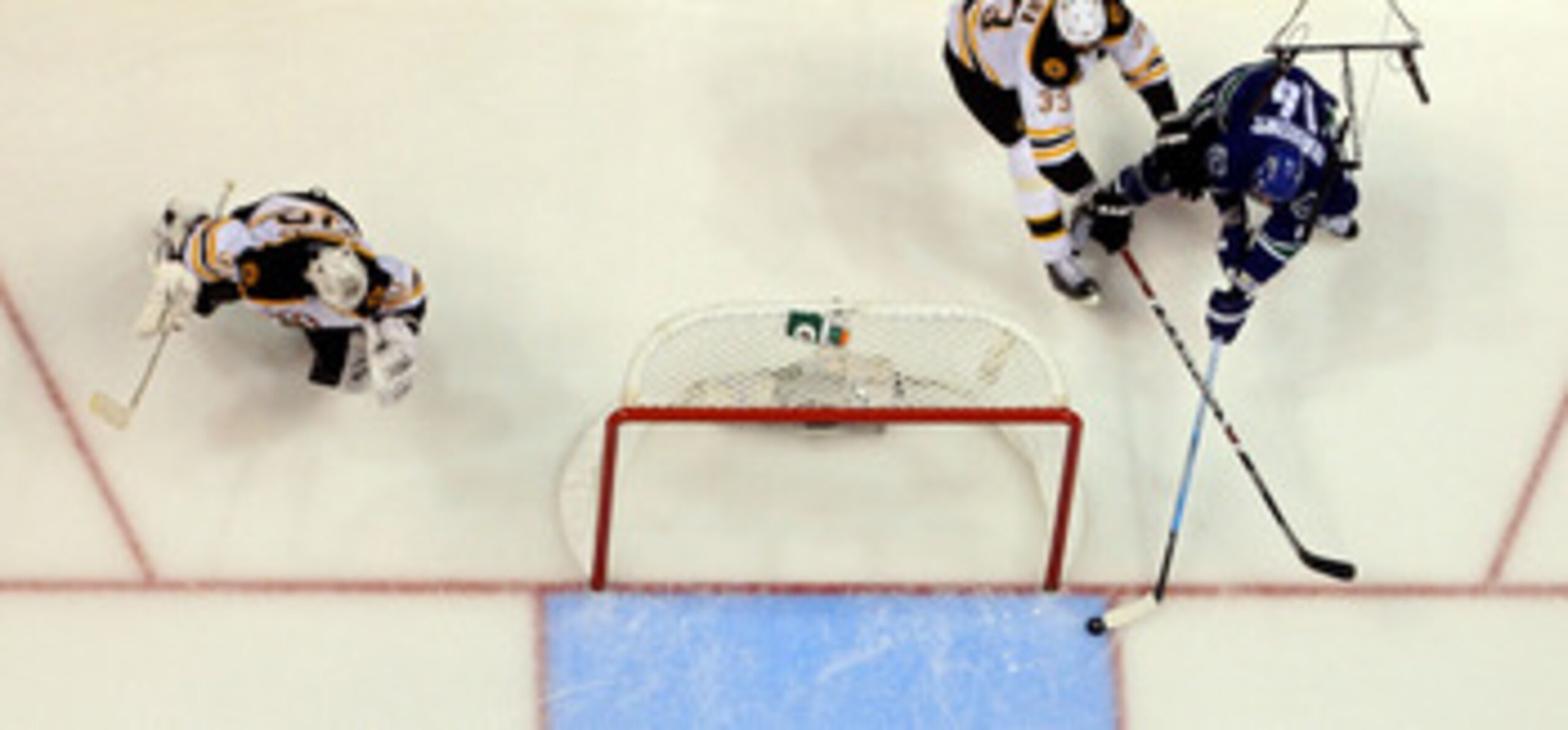 VANCOUVER, BC - JUNE 04:  Tomas Kaberle #12 of the Boston Bruins skates against Victor Oreskovich #38 of the Vancouver Canucks during Game Two of the 2011 NHL Stanley Cup Final at Rogers Arena on June 4, 2011 in Vancouver, British Columbia, Canada.  (Phot