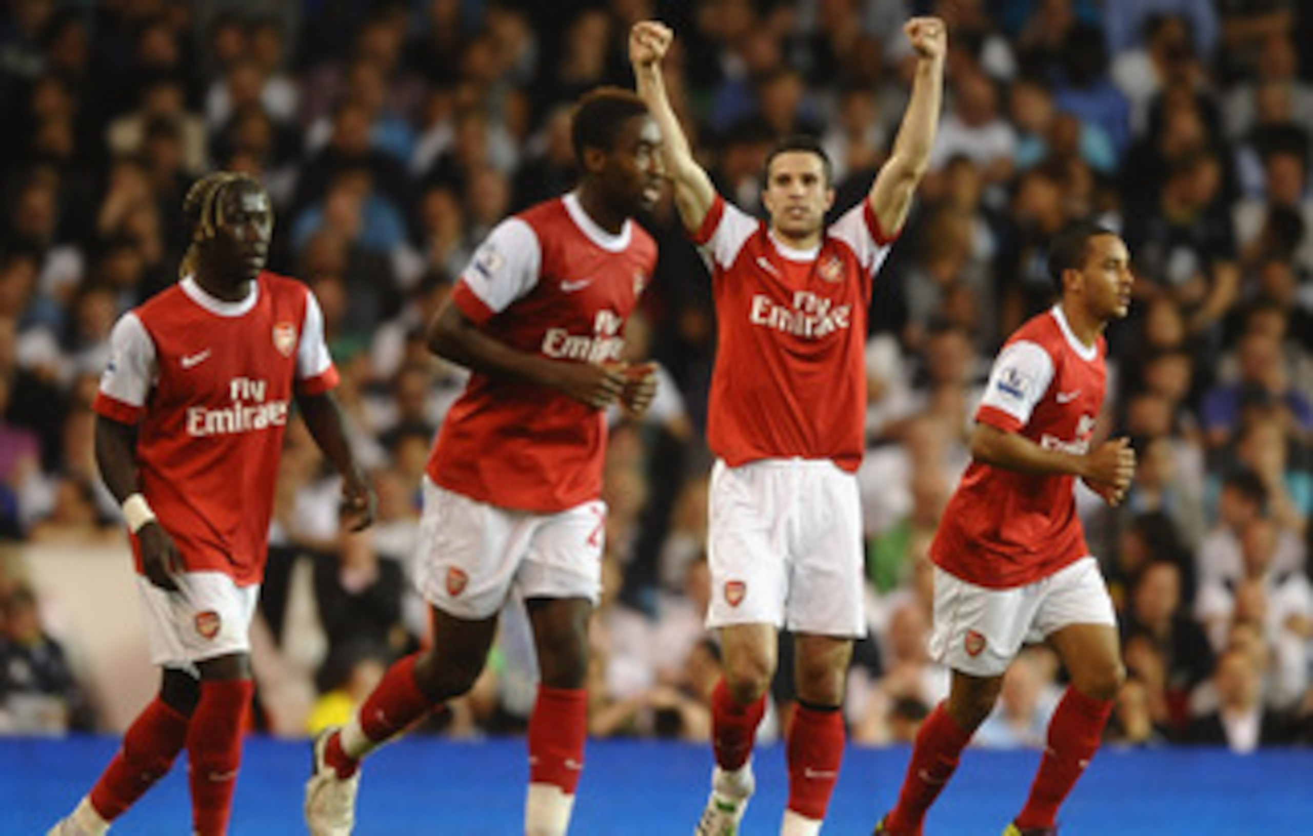LONDON, ENGLAND - APRIL 20:  Robin van Persie of Arsenal celebrates scoring their third goal during the Barclays Premier League match between Tottenham Hotspur and Arsenal at White Hart Lane on April 20, 2011 in London, England.  (Photo by Laurence Griffi