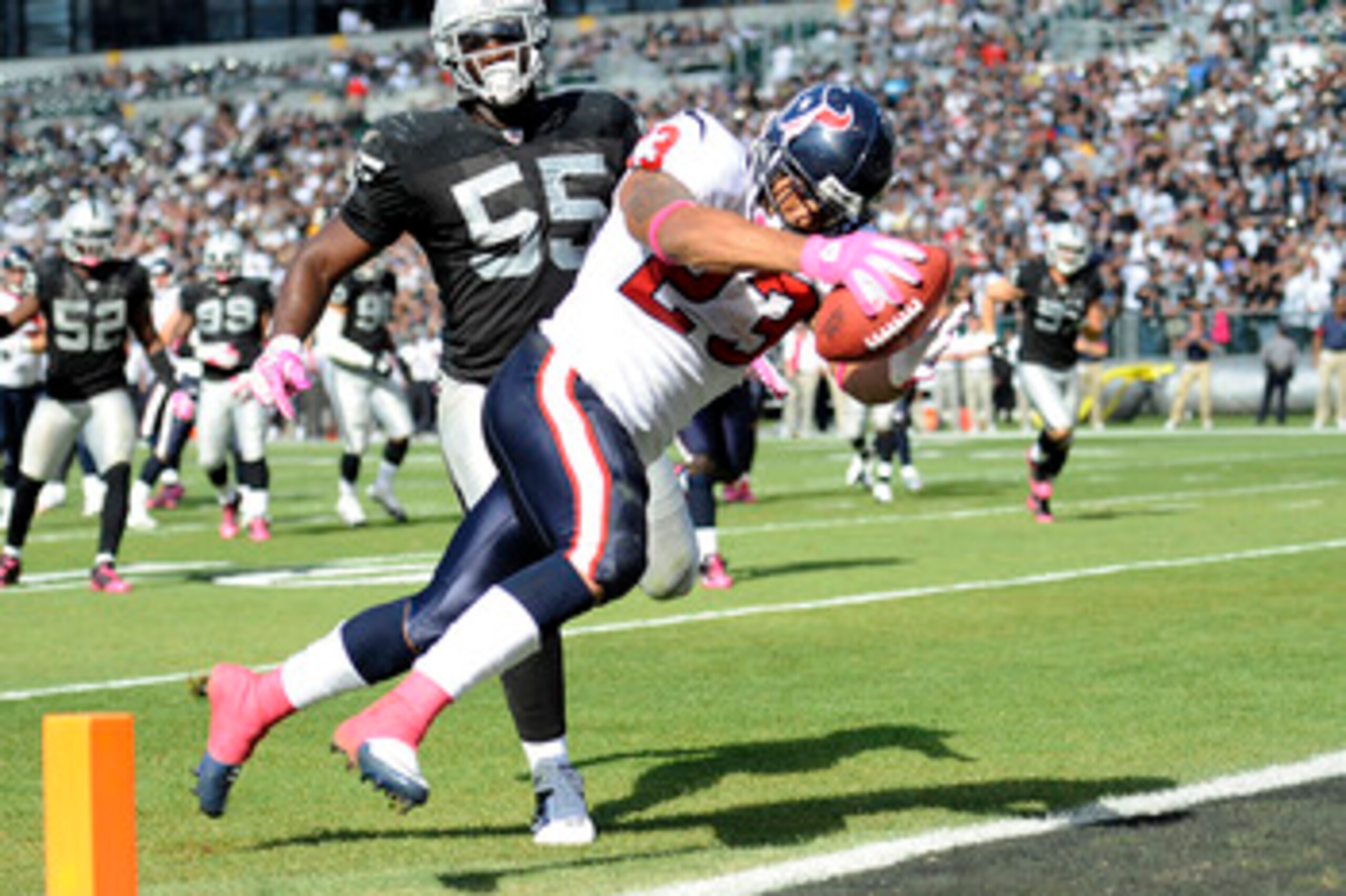 OAKLAND, CA - OCTOBER 3:  Running back Arian Foster #23 of the Houston Texans scores a touchdown in front of linebacker Rolando McClain #55 of the Oakland Raiders  during an NFL football game October 3, 2010 at The Oakland-Alameda County Coliseum in Oakla