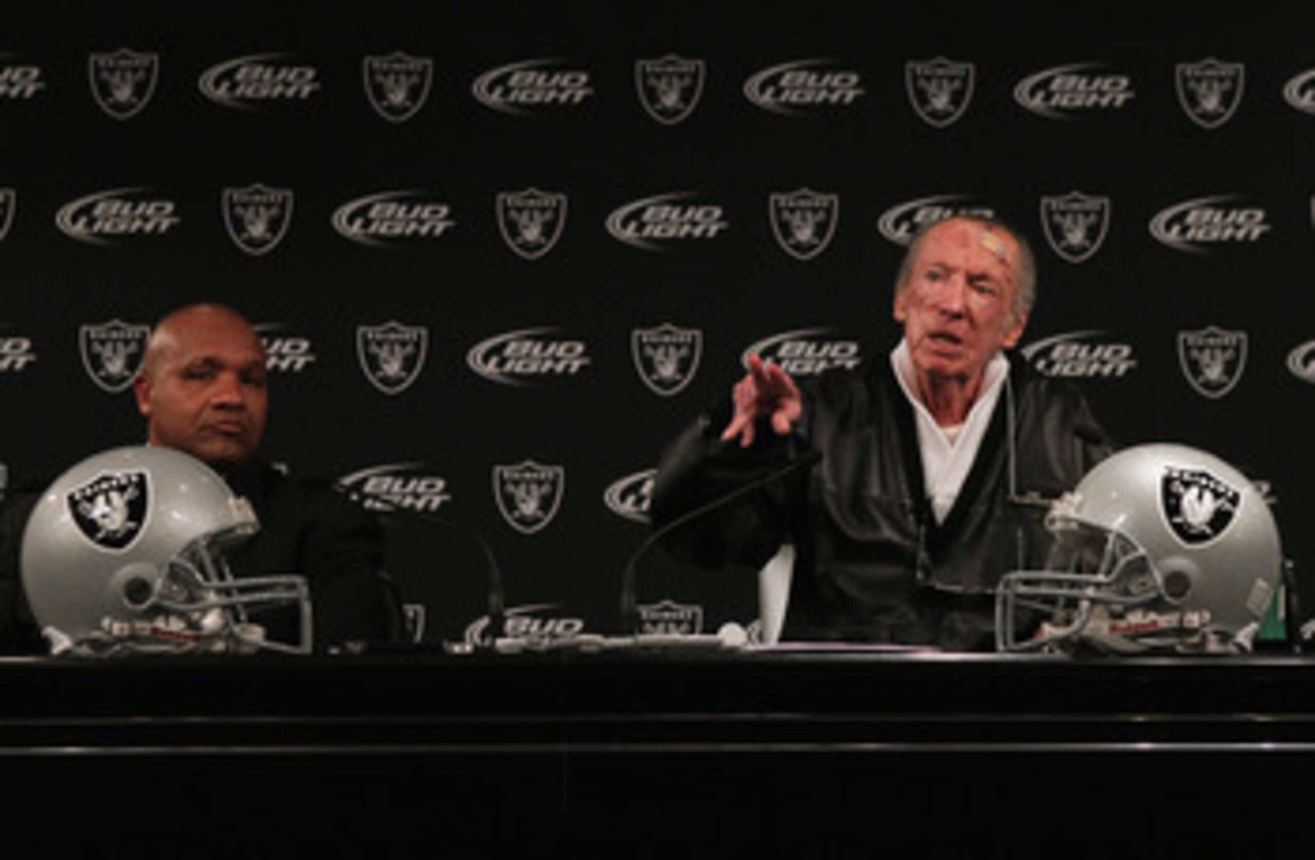 ALAMEDA, CA - JANUARY 18: New Oakland Raiders coach Hue Jackson (L) looks on as Raiders owner Al Davis speaks during a press conference on January 18, 2011 in Alameda, California. Hue Jackson was introduced as the new coach of the Oakland Raiders, replac ALAMEDA, CA - JANUARY 18: New Oakland Raiders coach Hue Jackson (L) looks on as Raiders owner Al Davis speaks during a press conference on January 18, 2011 in Alameda, California. Hue Jackson was introduced as the new coach of the Oakland Raiders, replac