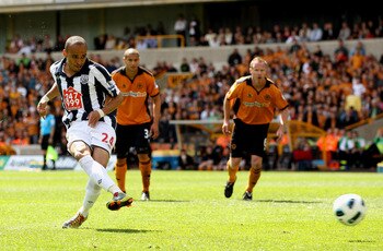WOLVERHAMPTON, ENGLAND - MAY 08:  Peter Odemwingie of WBA scores their first goal from the penalty spot during the Barclays Premier League match between Wolverhampton Wanderers and West Bromwich Albion at Molineux on May 8, 2011 in Wolverhampton, England.