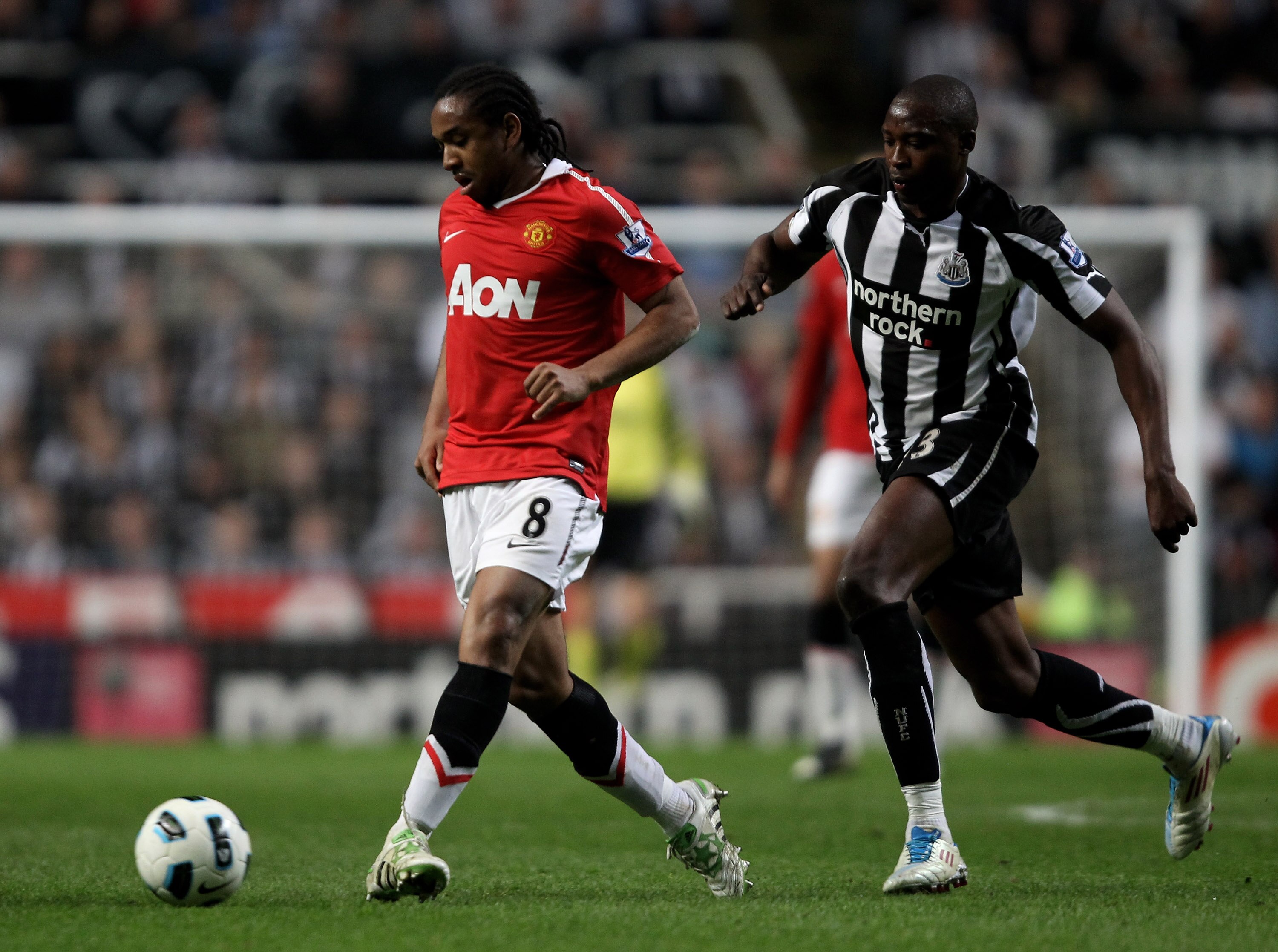 NEWCASTLE UPON TYNE, ENGLAND - APRIL 19:  Shola Ameobi of Newcastle United competes with Anderson of Manchester United during the Barclays Premier League match between Newcastle United and Manchester United at St James' Park on April 19, 2011 in Newcastle