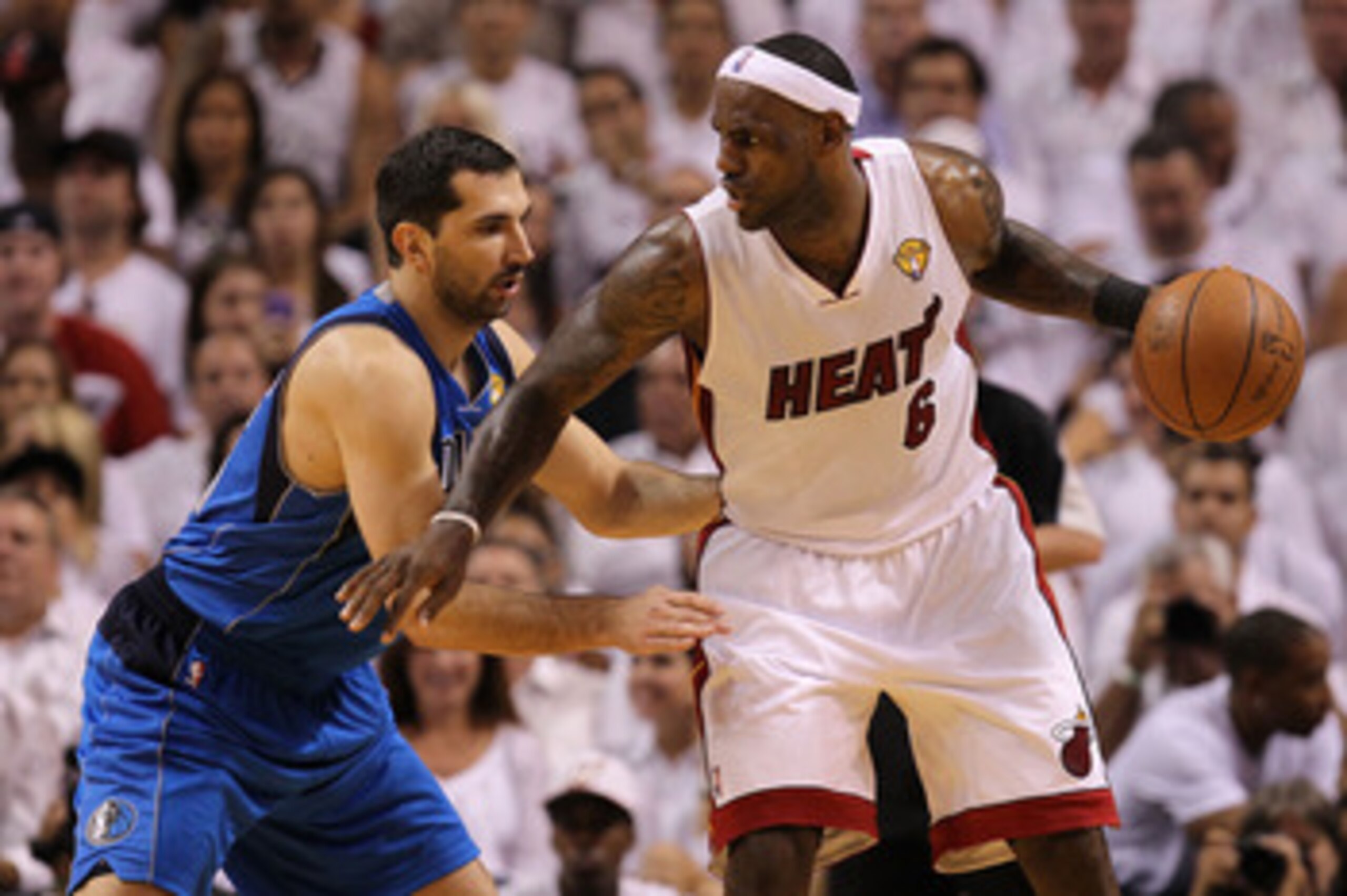 MIAMI, FL - MAY 31:  LeBron James #6 of the Miami Heat posts up Peja Stojakovic #16 of the Dallas Mavericks in the first quarter in Game One of the 2011 NBA Finals at American Airlines Arena on May 31, 2011 in Miami, Florida. NOTE TO USER: User expressly