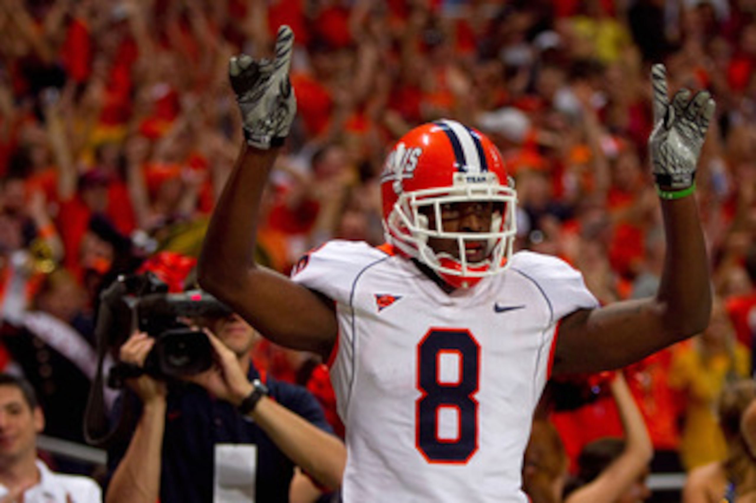 ST. LOUIS - SEPTEMBER 4: A.J. Jenkins #8 of the University of Illinois Fighting Illini celebrates his touchdown against the University of Missouri Tigers during the State Farm Arch Rivalry game on September 4, 2010 at the Edward Jones Dome in St. Louis, M