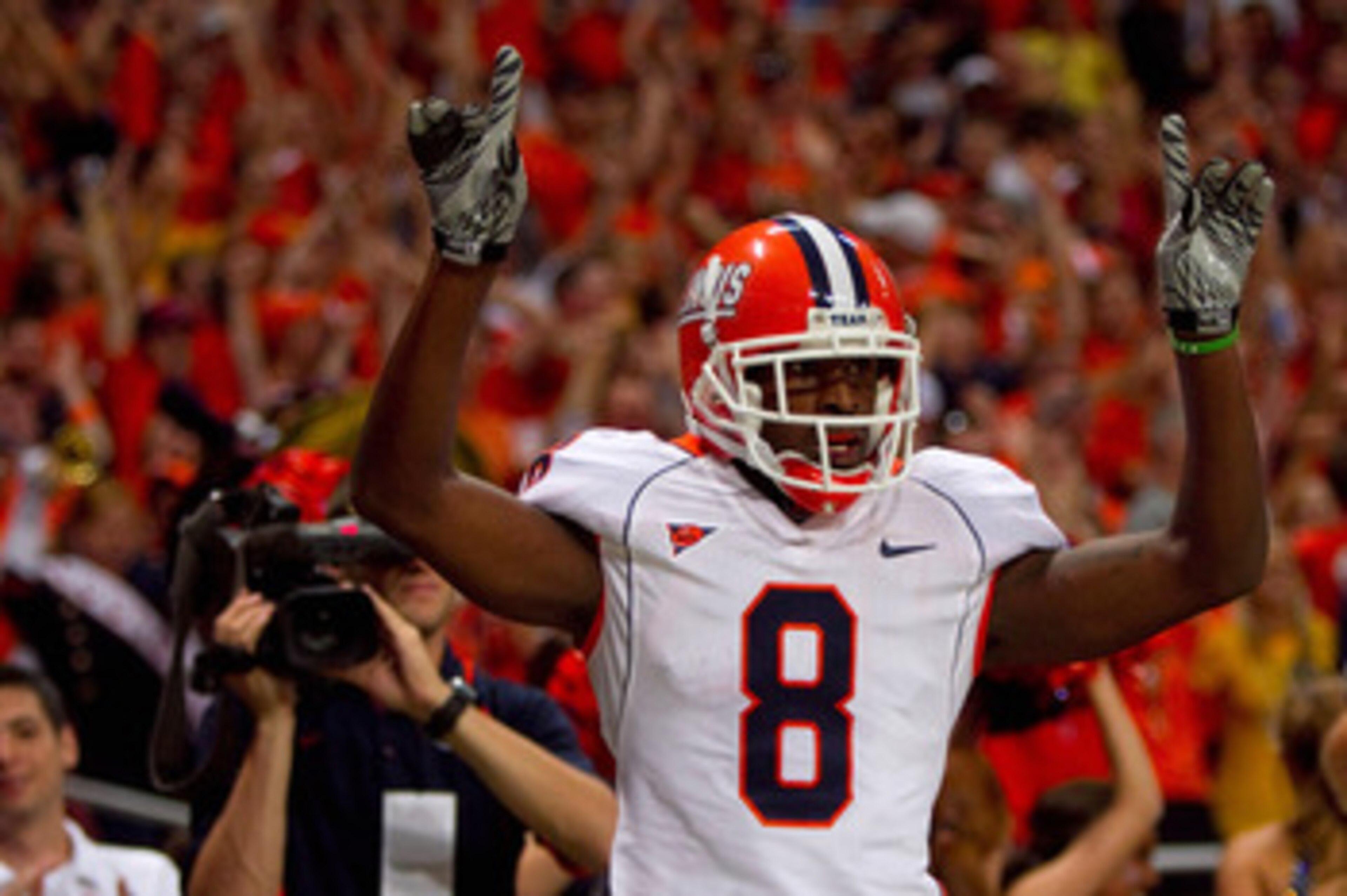 ST. LOUIS - SEPTEMBER 4: A.J. Jenkins #8 of the University of Illinois Fighting Illini celebrates his touchdown against the University of Missouri Tigers during the State Farm Arch Rivalry game on September 4, 2010 at the Edward Jones Dome in St. Louis, M