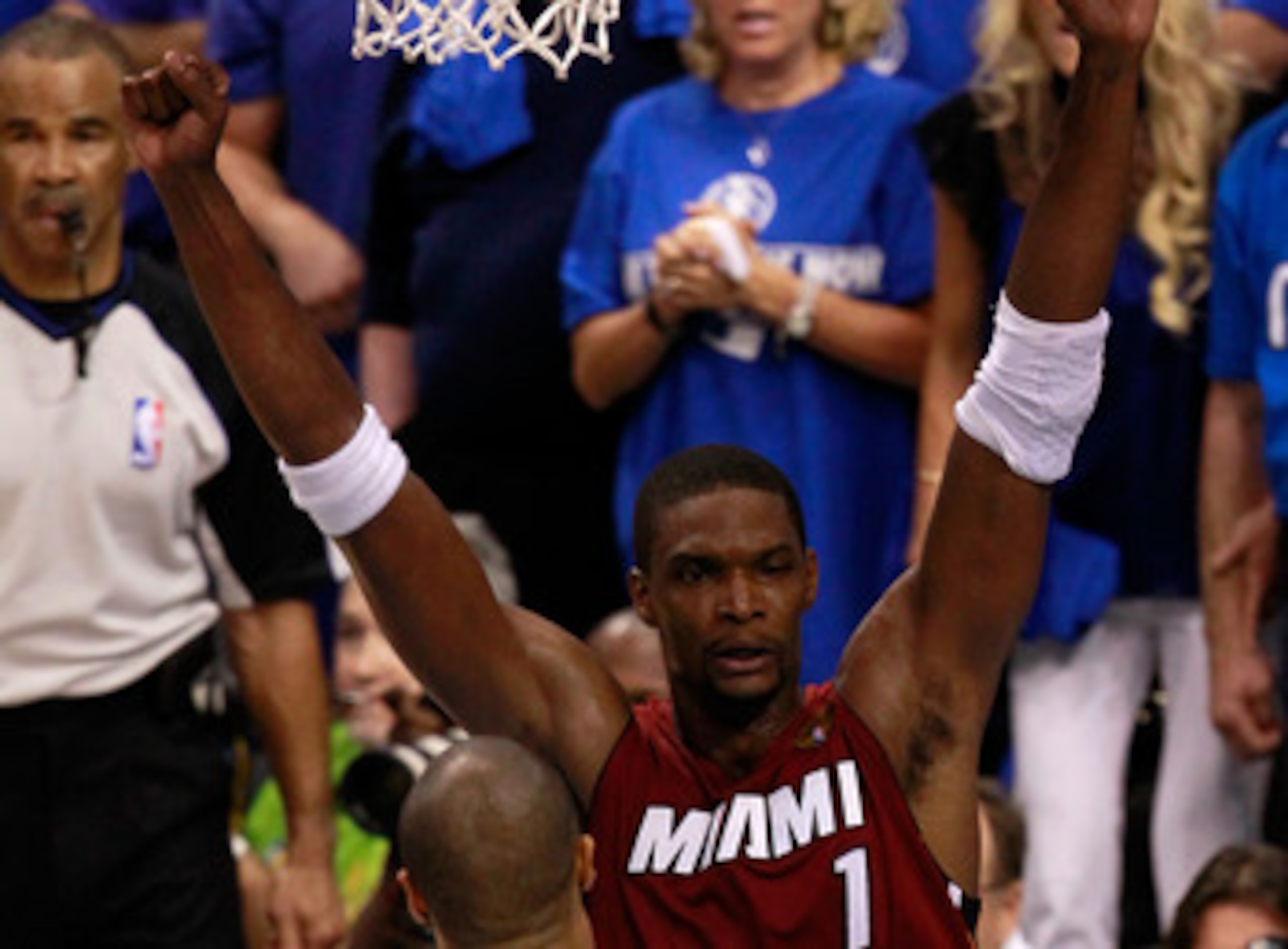 DALLAS, TX - JUNE 05:  Chris Bosh #1 of the Miami Heat celebrates against Tyson Chandler #6 of the Dallas Mavericks after the Heat won 88-86 in Game Three of the 2011 NBA Finals at American Airlines Center on June 5, 2011 in Dallas, Texas.  NOTE TO USER: