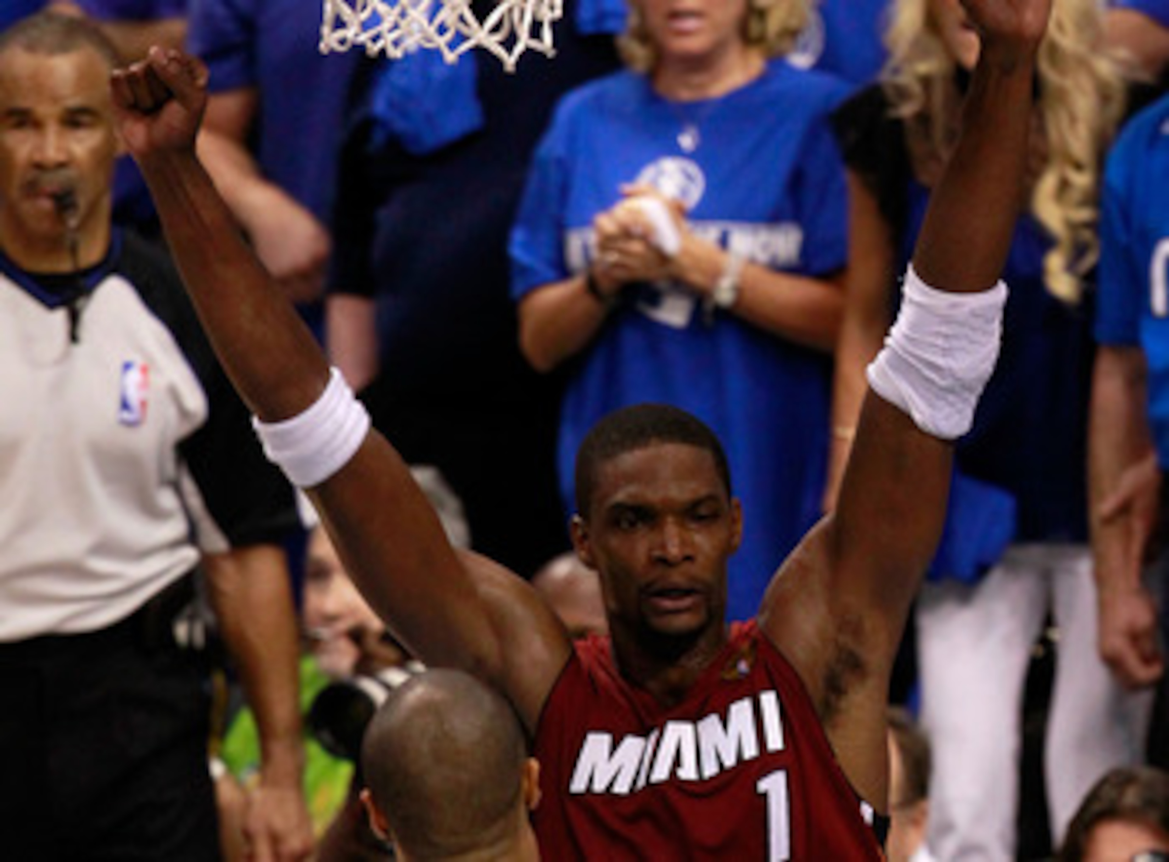 DALLAS, TX - JUNE 05:  Chris Bosh #1 of the Miami Heat celebrates against Tyson Chandler #6 of the Dallas Mavericks after the Heat won 88-86 in Game Three of the 2011 NBA Finals at American Airlines Center on June 5, 2011 in Dallas, Texas.  NOTE TO USER: