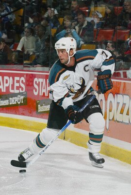 LONDON, ONTARIO - OCTOBER 17:  Nolan Baumgartner #7 of the Manitoba Moose stickhandles behind the net during the game against the Hamilton Bulldogs at the Copps Coliseum on October 17, 2004 in Hamilton, Ontario, Canada. (Photo by Claus Andersen/Getty Imag