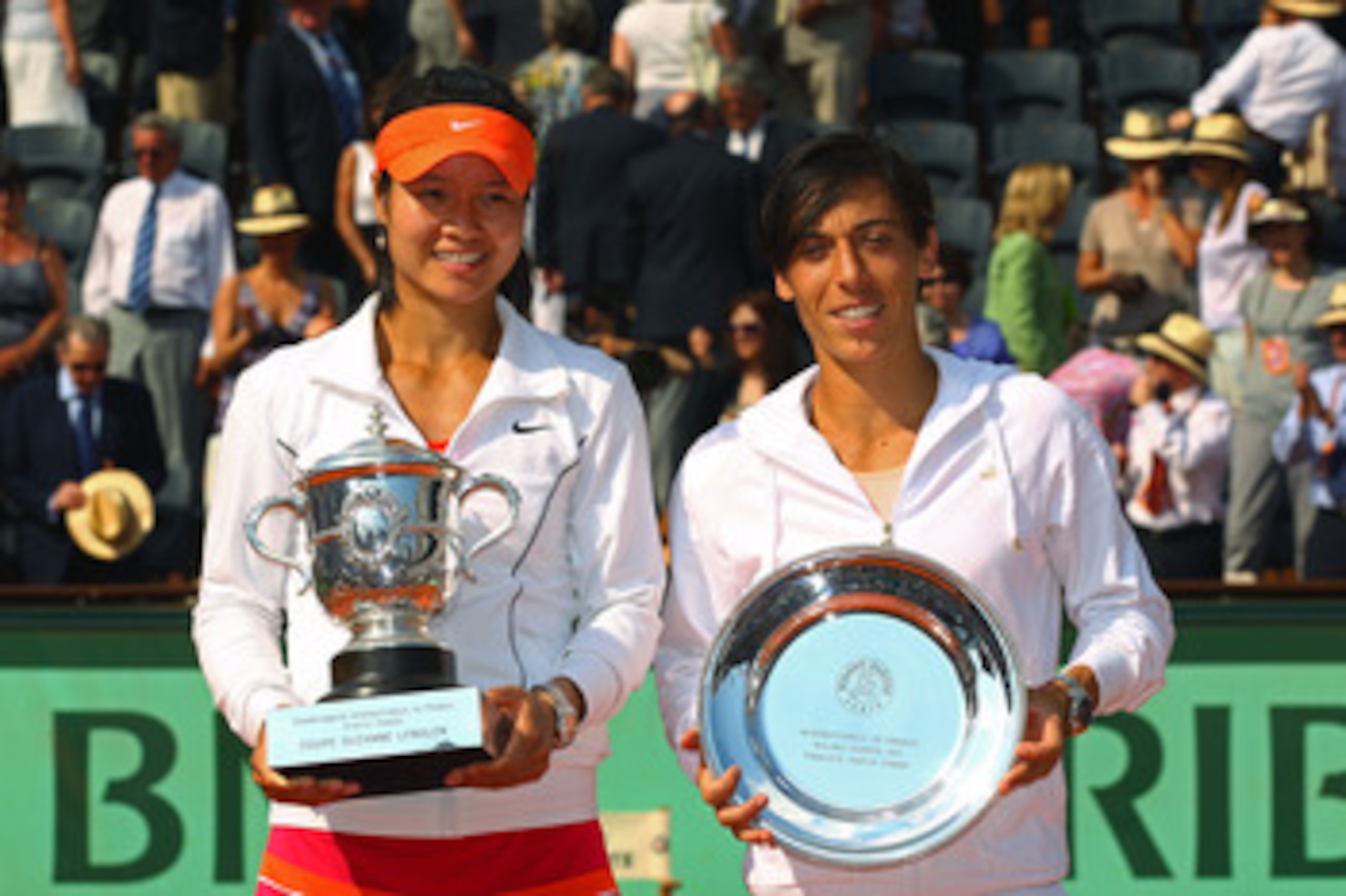 PARIS, FRANCE - JUNE 04:  Women's champion Na Li of China and runner up Francesca Schiavone of Italy pose with the trophies during the women's singles final match between Francesca Schiavone of Italy and Na Li of China on day fourteen of the French Open a