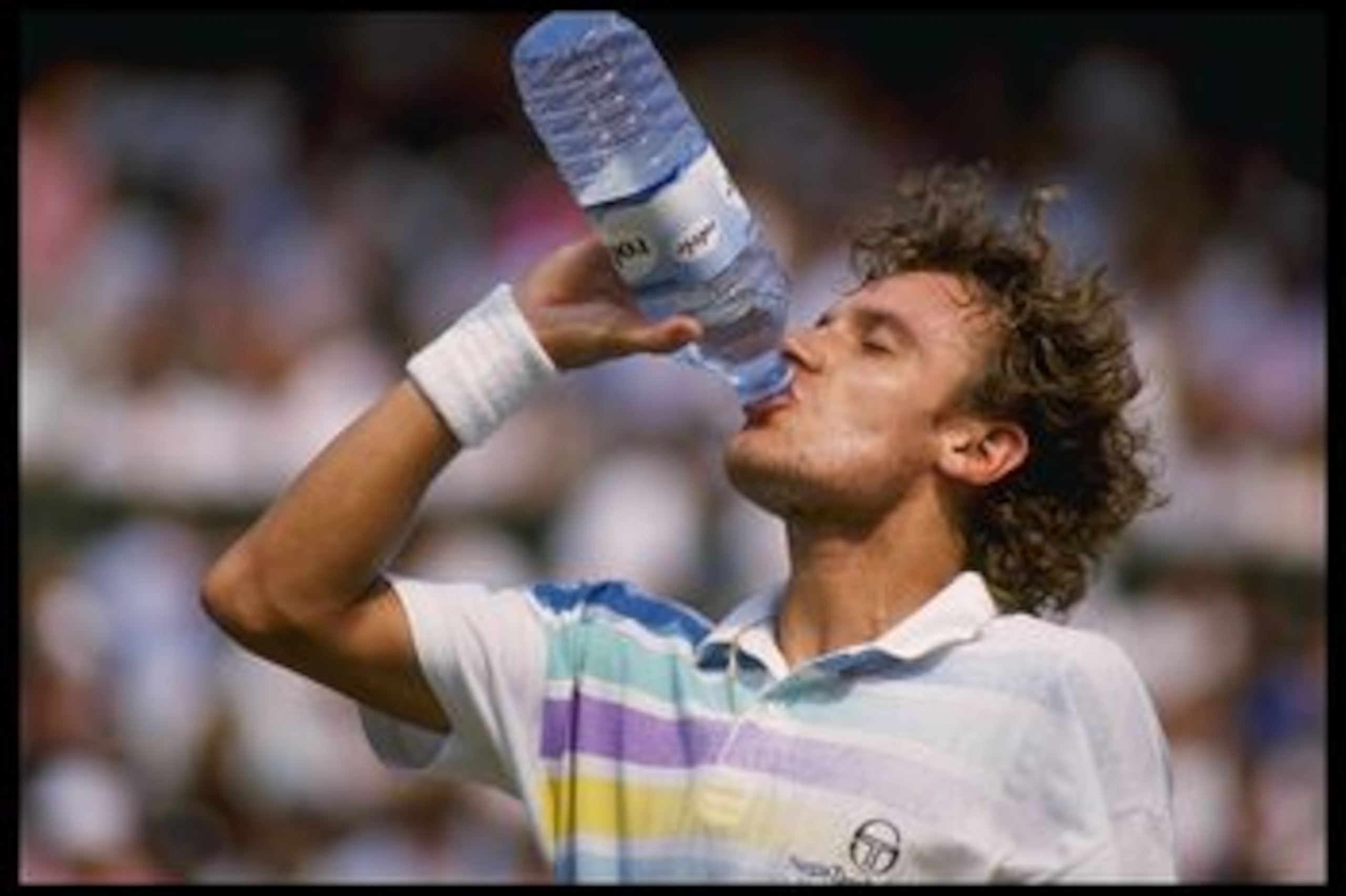 Jun 1989:  Mats  Willander of Sweden takes a water break during the Wimbledon tennis championships at the all England club in London.                                                                                Mandatory Credit: Allsport UK