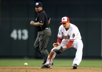 PHOENIX, AZ - MAY 30:  Infielder Kelly Johnson #2 of the Arizona Diamondbacks fields a ground ball out against the Florida Marlins during the Major League Baseball game at Chase Field on May 30, 2011 in Phoenix, Arizona.  The Diamondbacks defeated the Mar