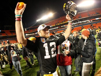 MIAMI GARDENS, FL - JANUARY 05:  Ricky Stanzi #12 of the Iowa Hawkeyes celebrates after their 24-14 win against the Georgia Tech Yellow Jackets during the FedEx Orange Bowl at Land Shark Stadium on January 5, 2010 in Miami Gardens, Florida.  (Photo by Str