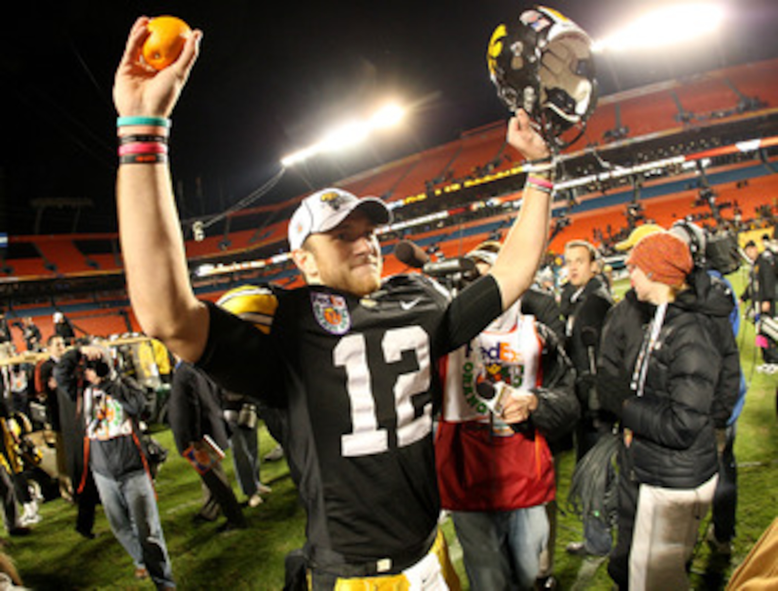 MIAMI GARDENS, FL - JANUARY 05:  Ricky Stanzi #12 of the Iowa Hawkeyes celebrates after their 24-14 win against the Georgia Tech Yellow Jackets during the FedEx Orange Bowl at Land Shark Stadium on January 5, 2010 in Miami Gardens, Florida.  (Photo by Str